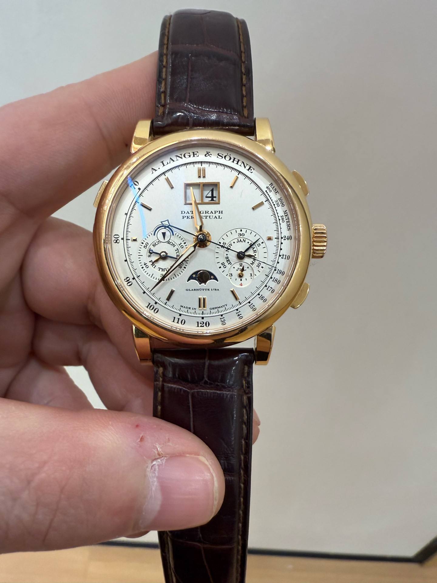 May be an image of wrist watch and text