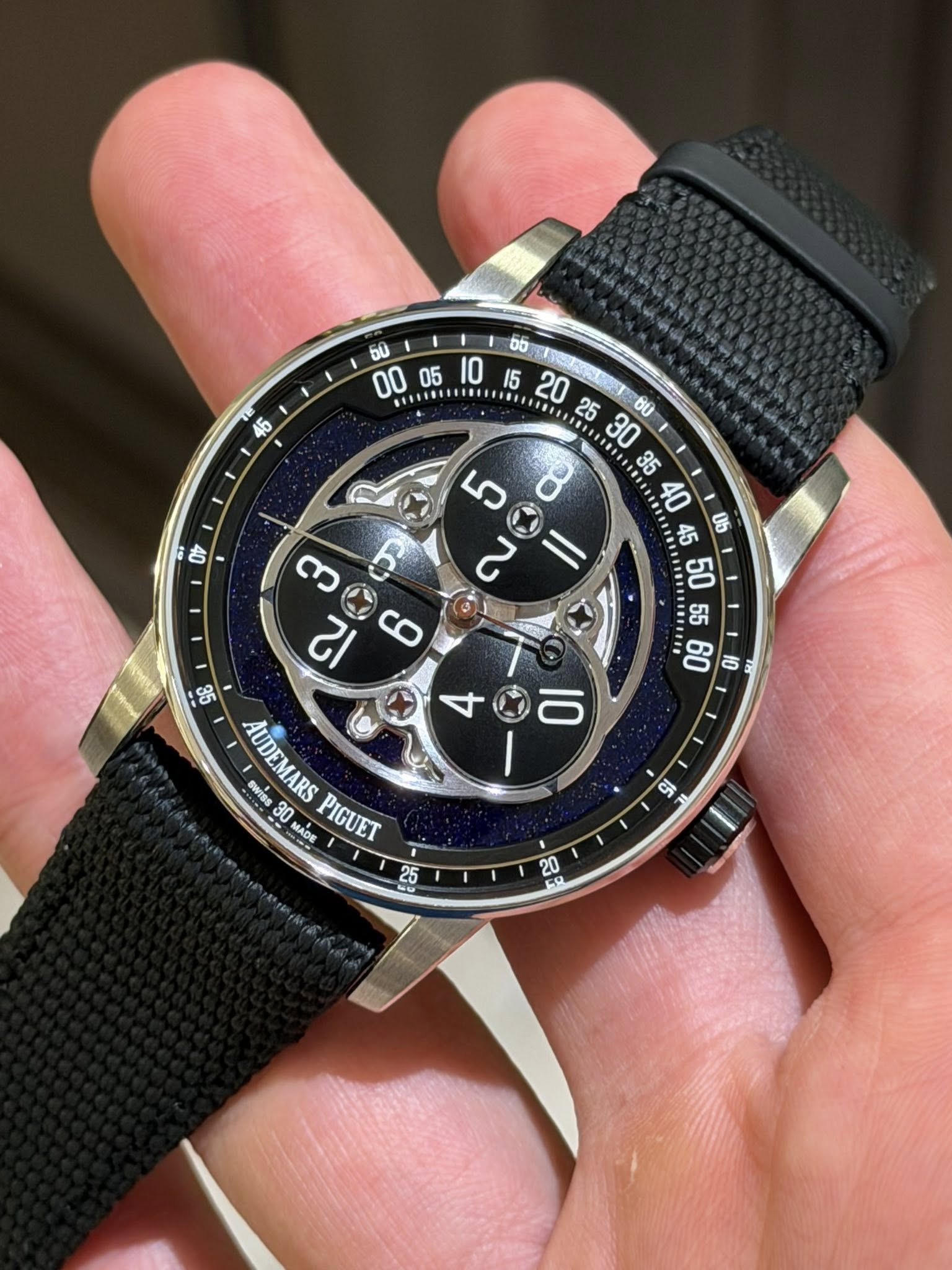 May be an image of digital watch and text that says '46 ចប ០ 00 SENS.N IE 25 SO....... ま車 Ub S ١ا C က ፍ So 98 AUDEMARSPIGUET レー AUDEMARS ewiss 30 MiDE MADE S0 PIGUET O ા อีี 20…