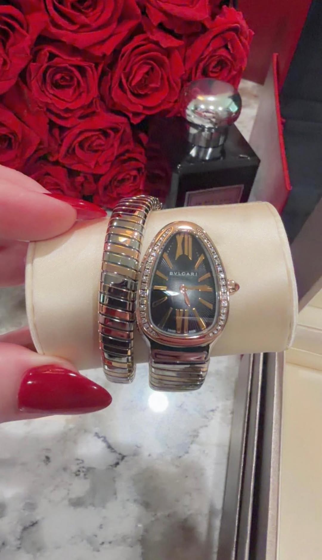 May be an image of wrist watch, jewelry and text