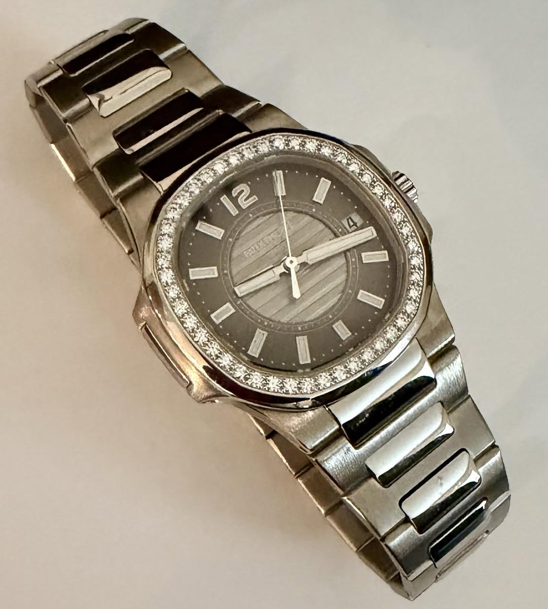 May be an image of wrist watch and text