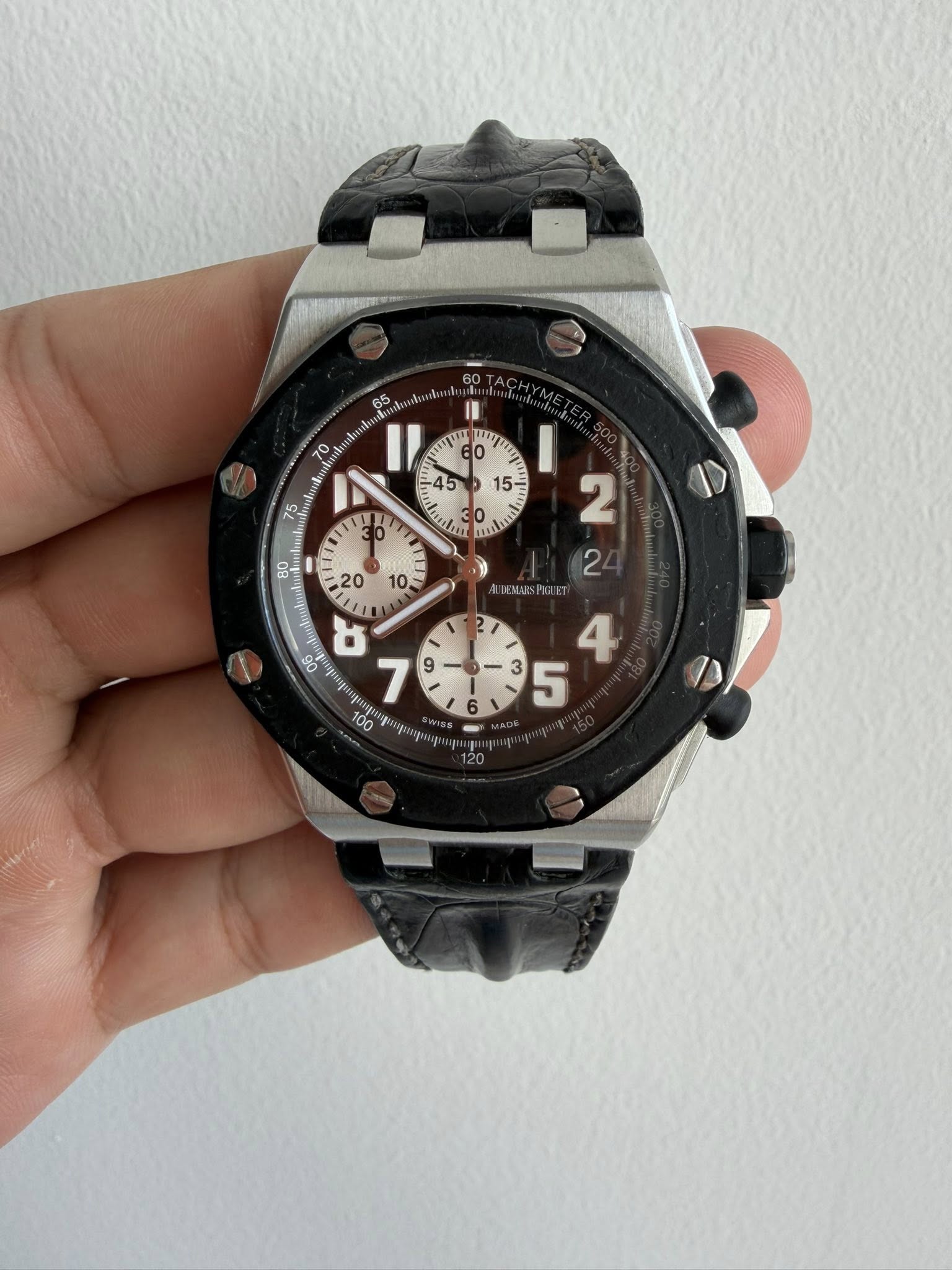 May be an image of wrist watch and text