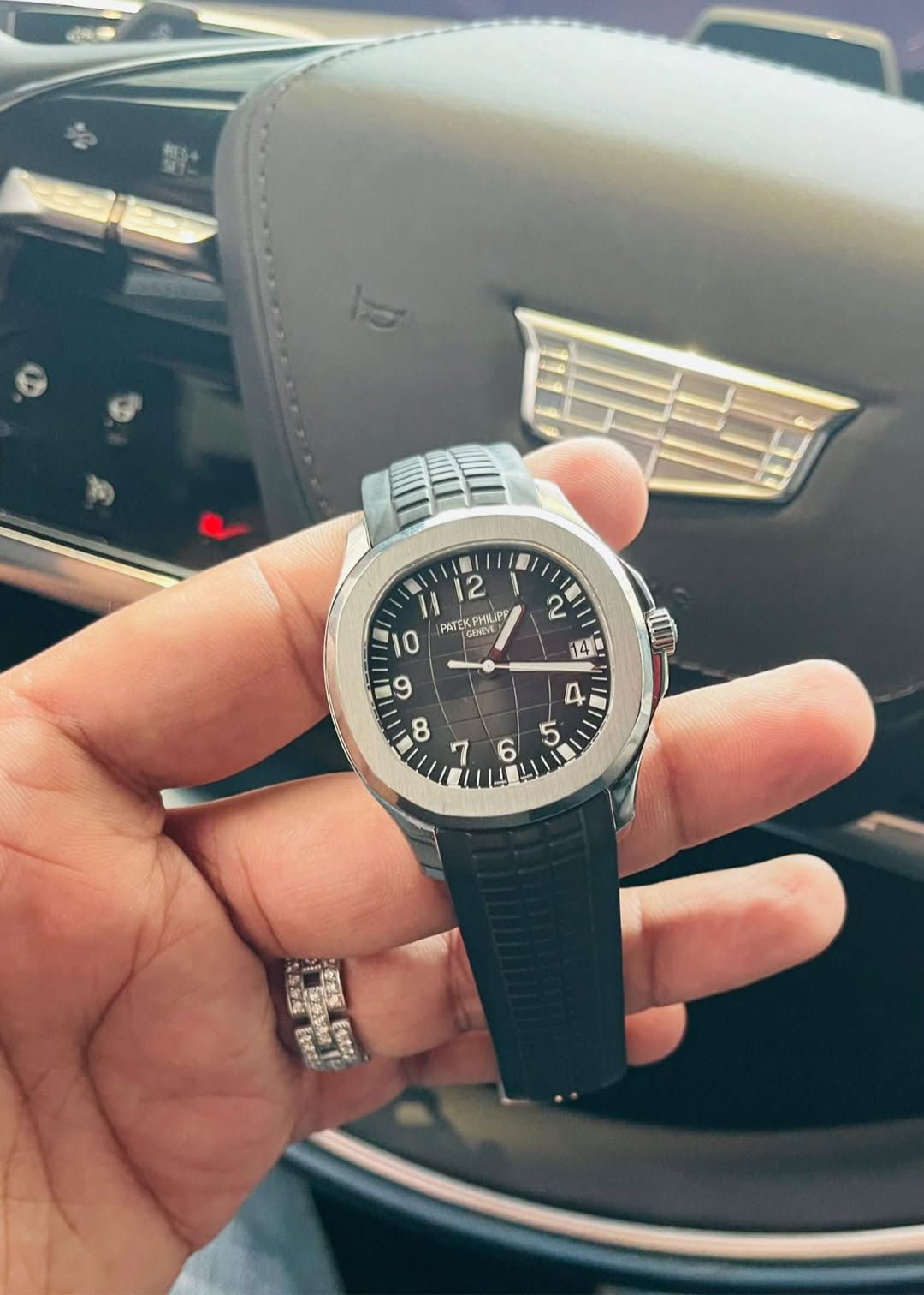 May be an image of wrist watch and text
