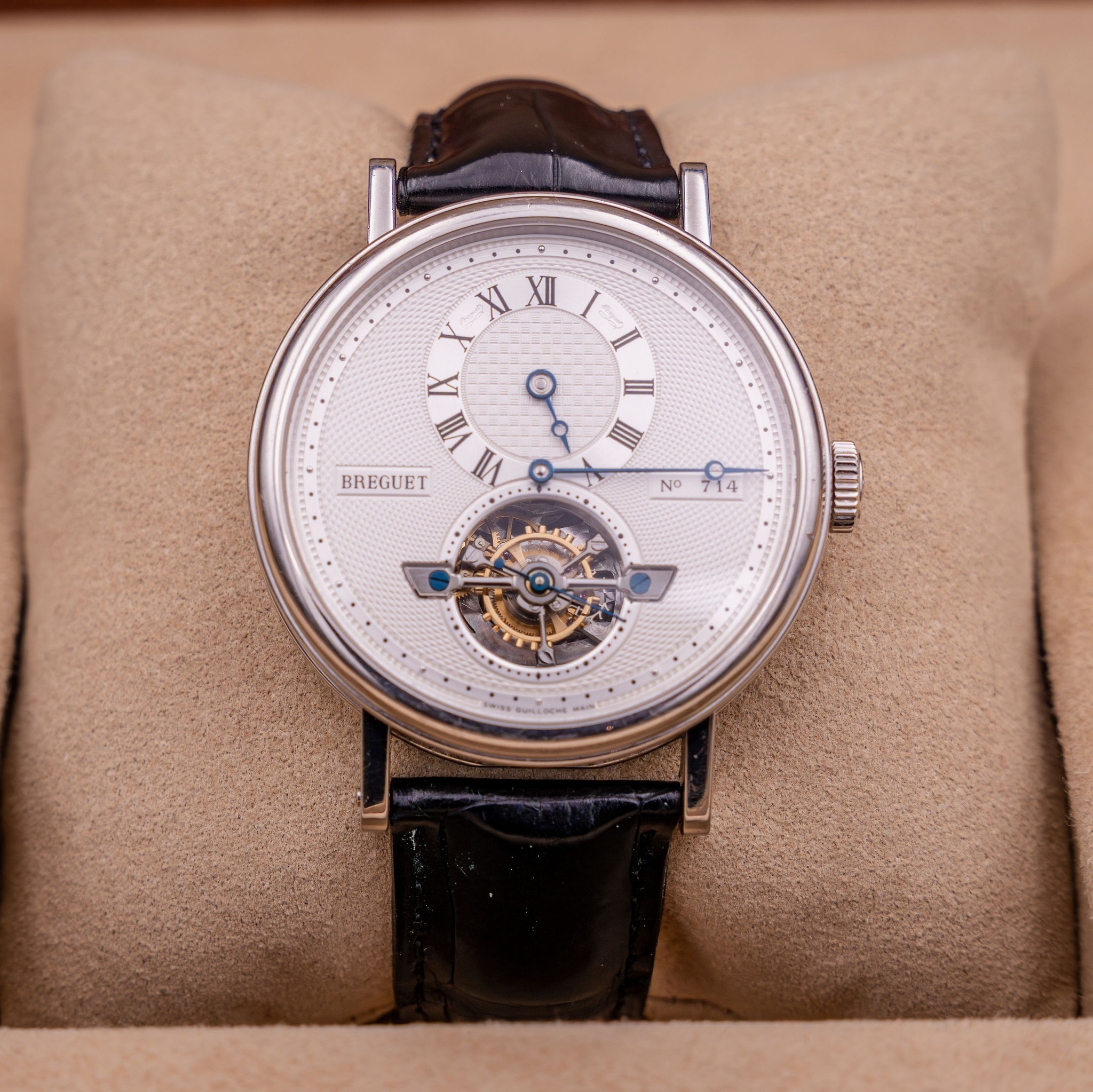 May be an image of wrist watch and text that says 'XI XII ١ IX 三 И I I 昌 BREGUET ® No O 14 14'