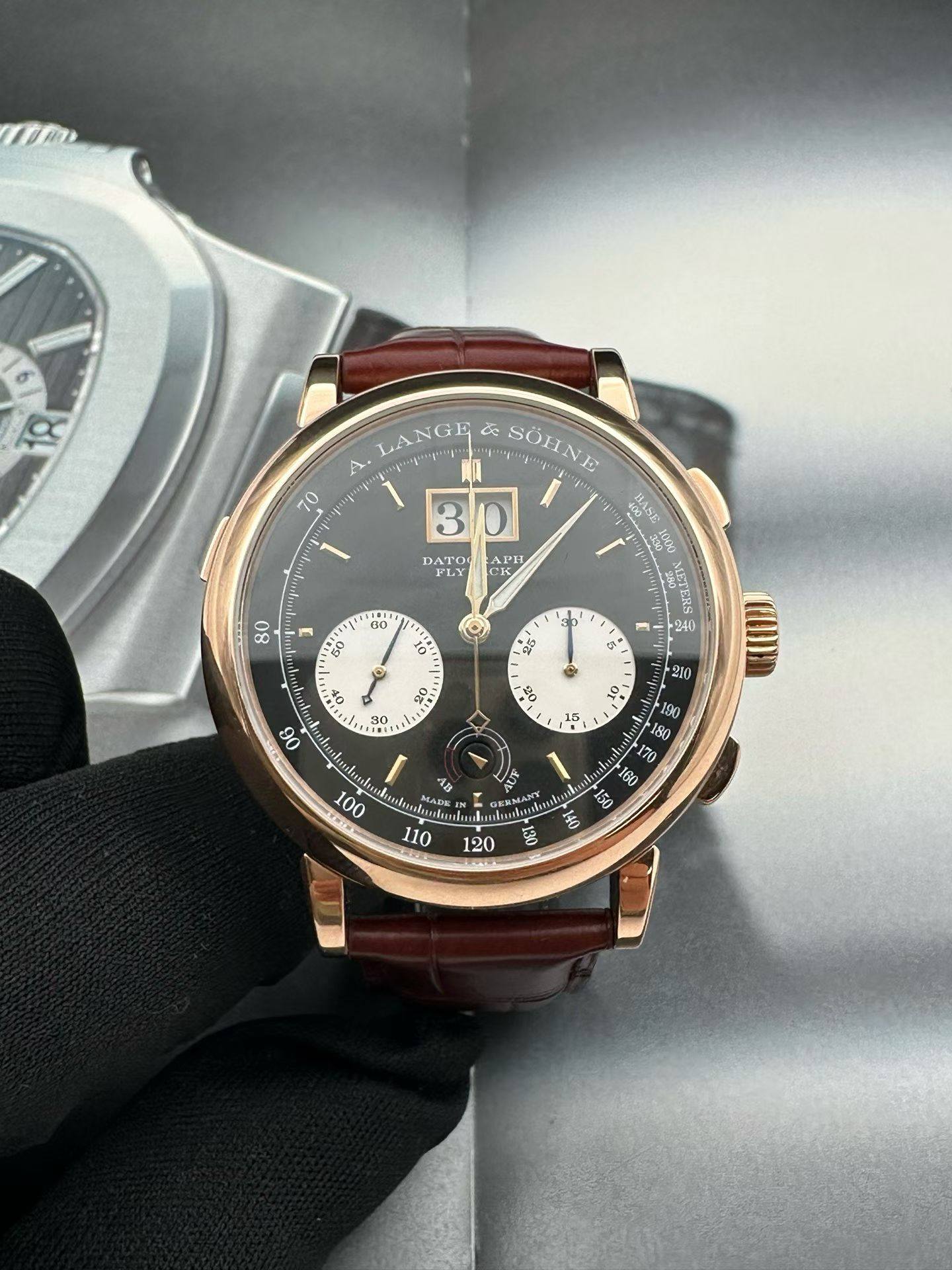 May be an image of wrist watch and text