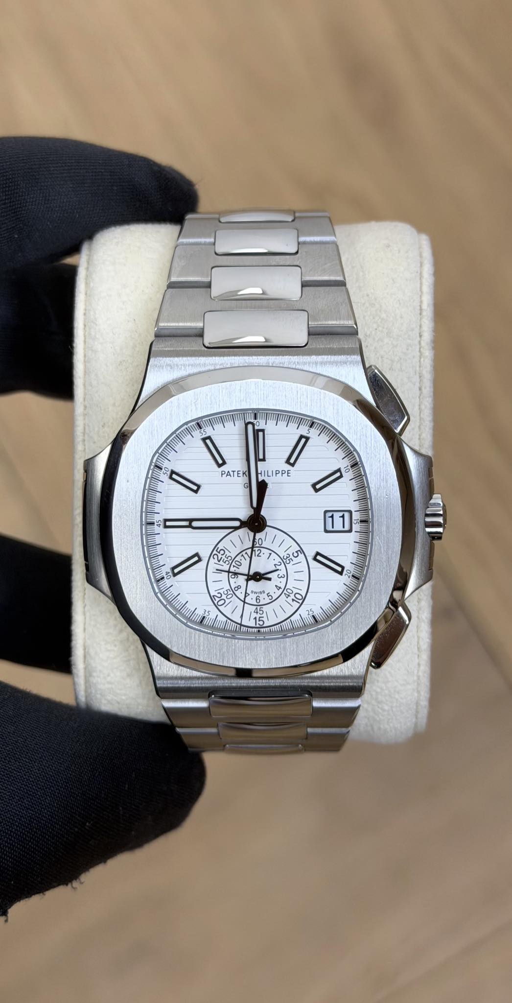 May be an image of wrist watch and text