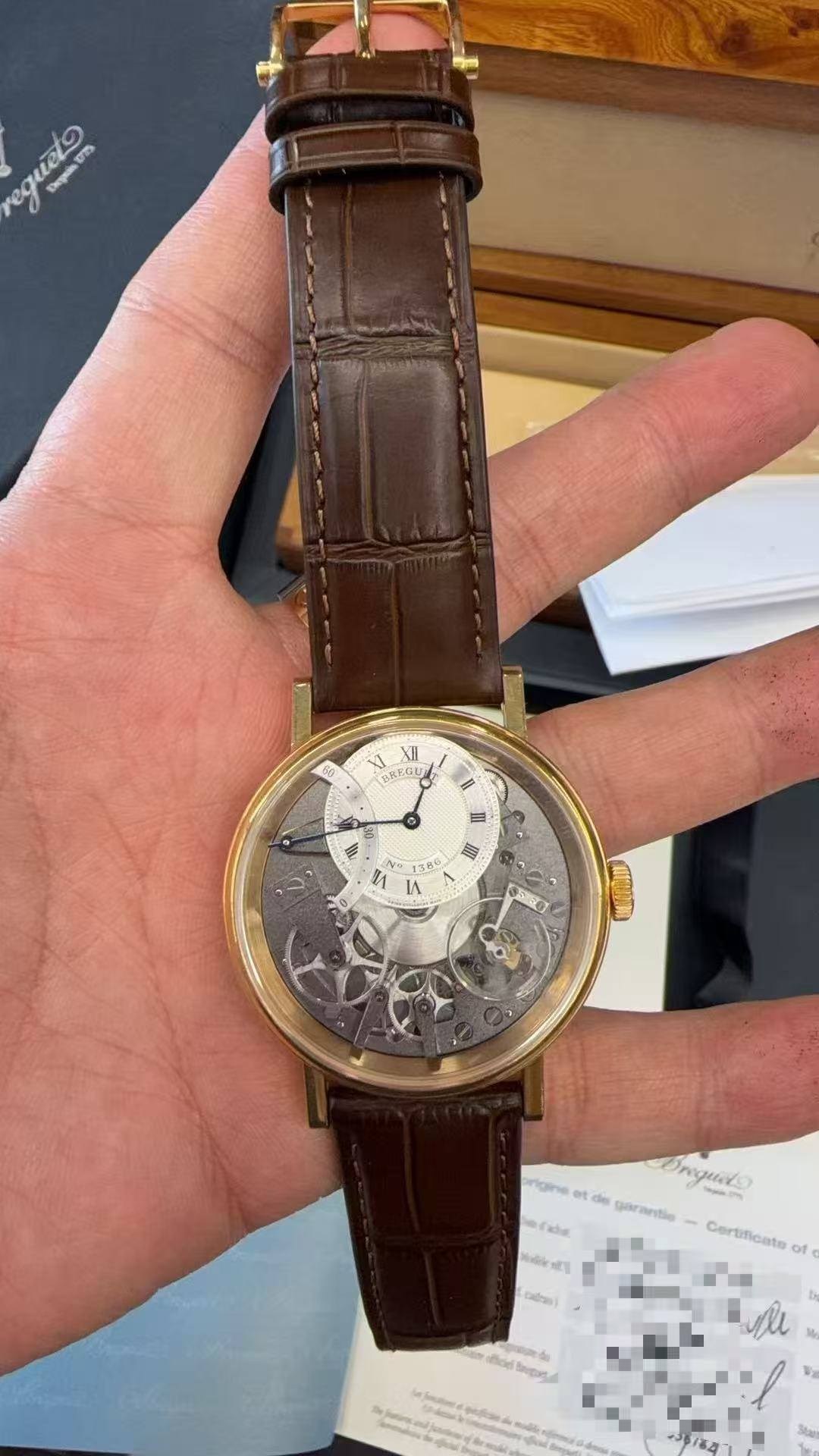 May be an image of wrist watch and text