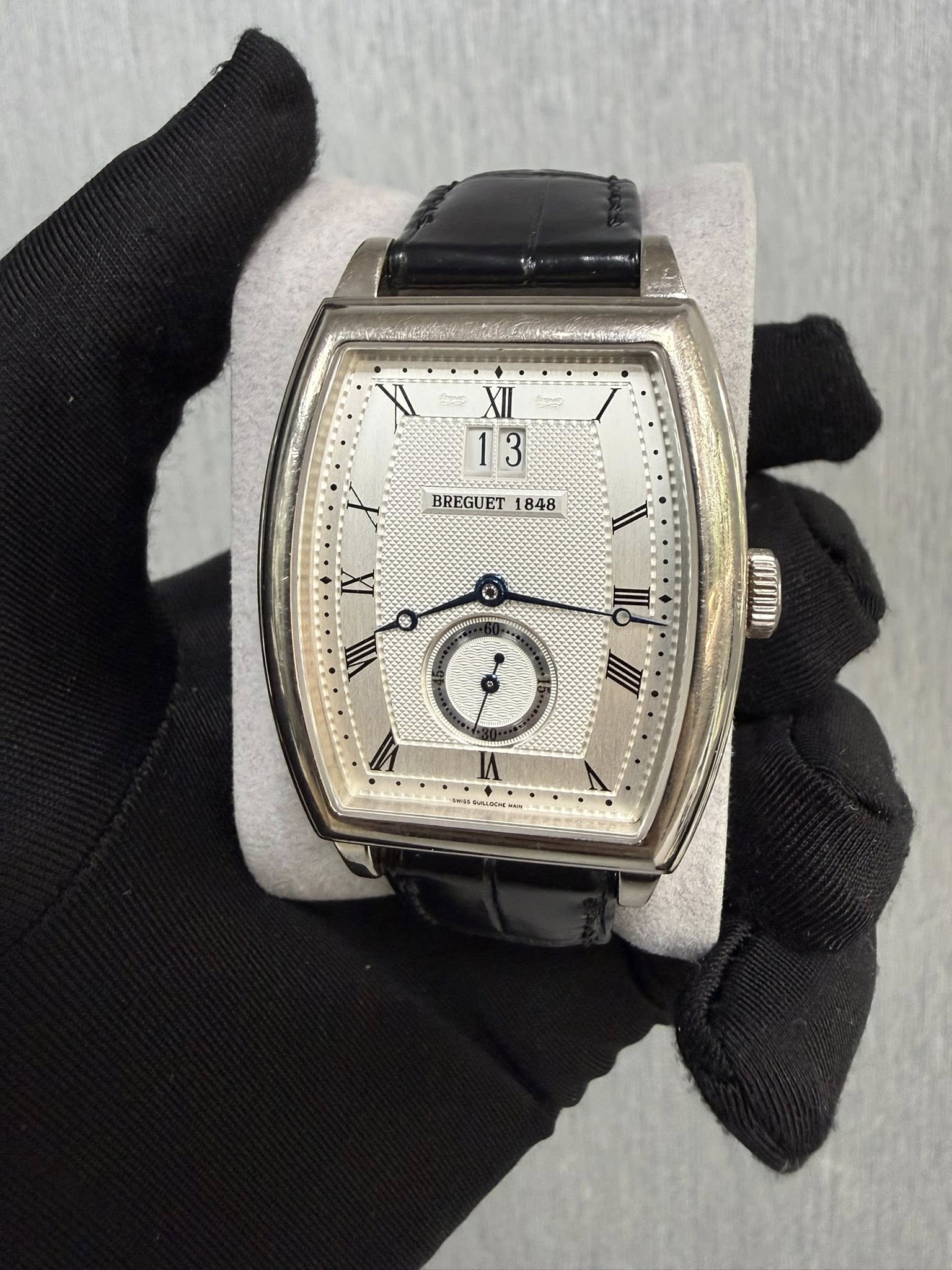 May be an image of wrist watch and text