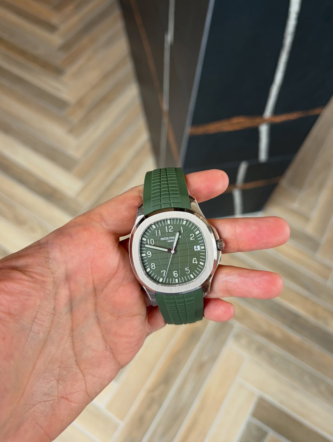 May be an image of wrist watch and text
