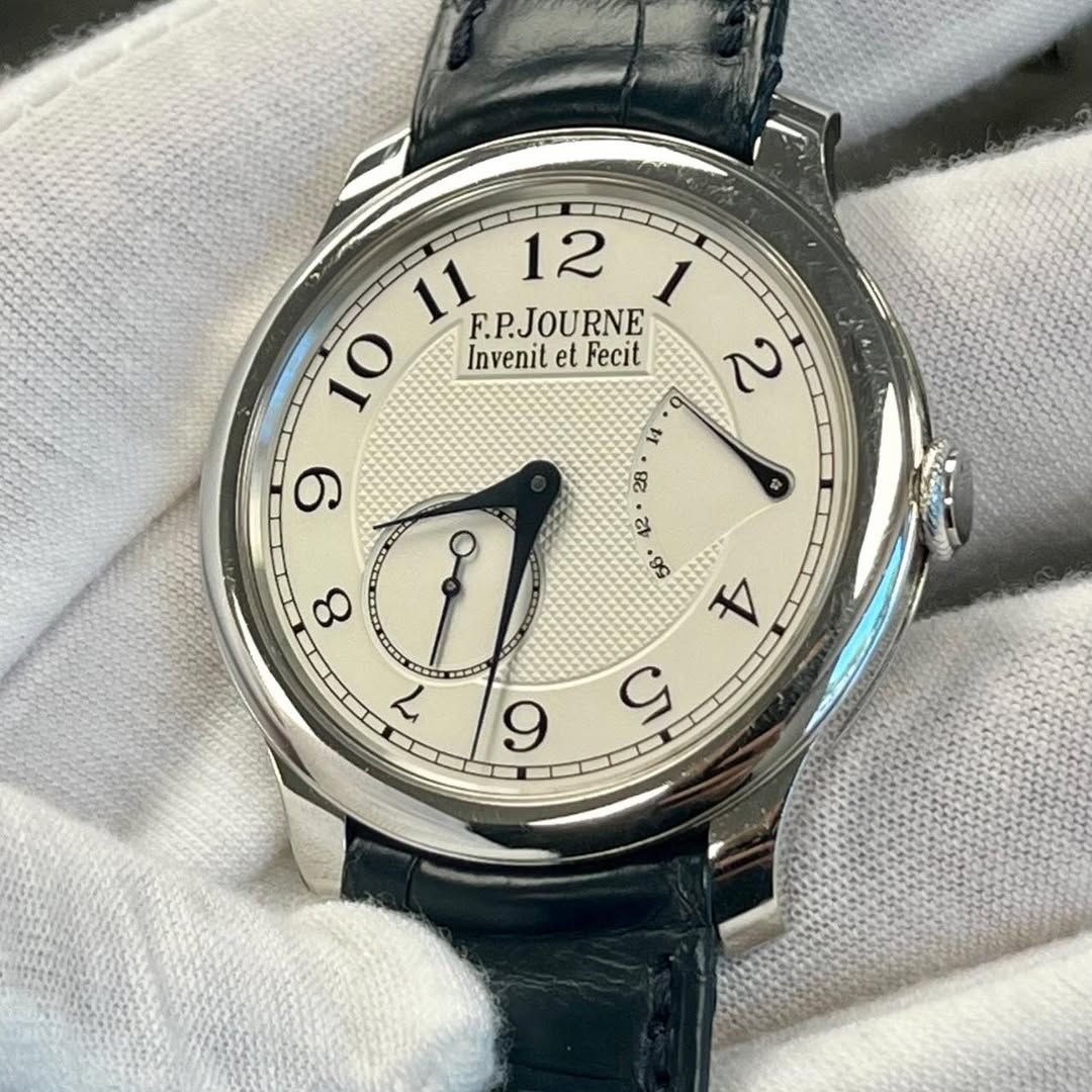 May be an image of wrist watch and text that says '11 F.P.JOURNE F.P. 12 1 10 Invenit InveniletFecit et Fecit 2 = 9 23 क 99 8 7 4 S 9'