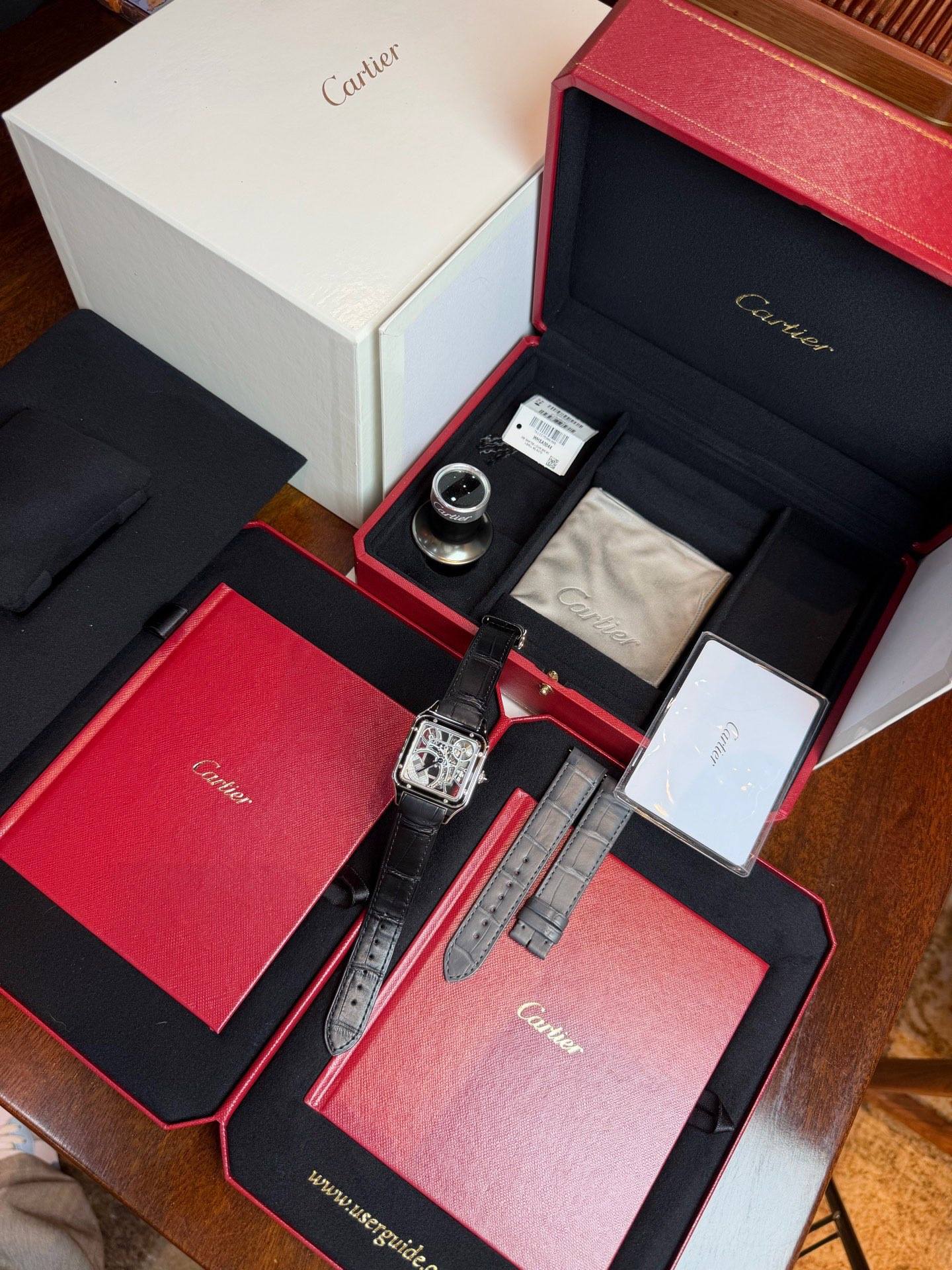 May be an image of cufflinks, wrist watch and text