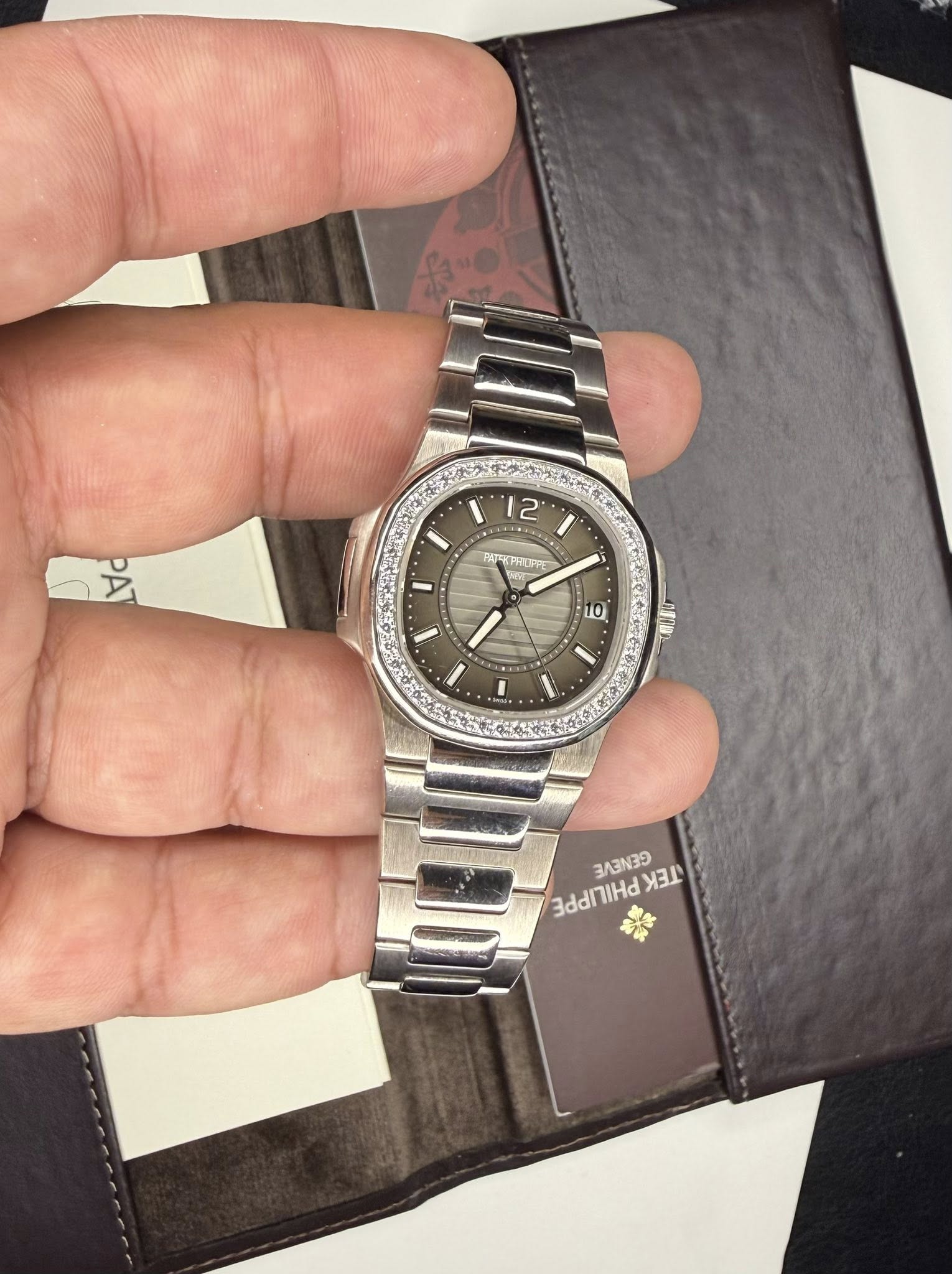 May be an image of wrist watch and text