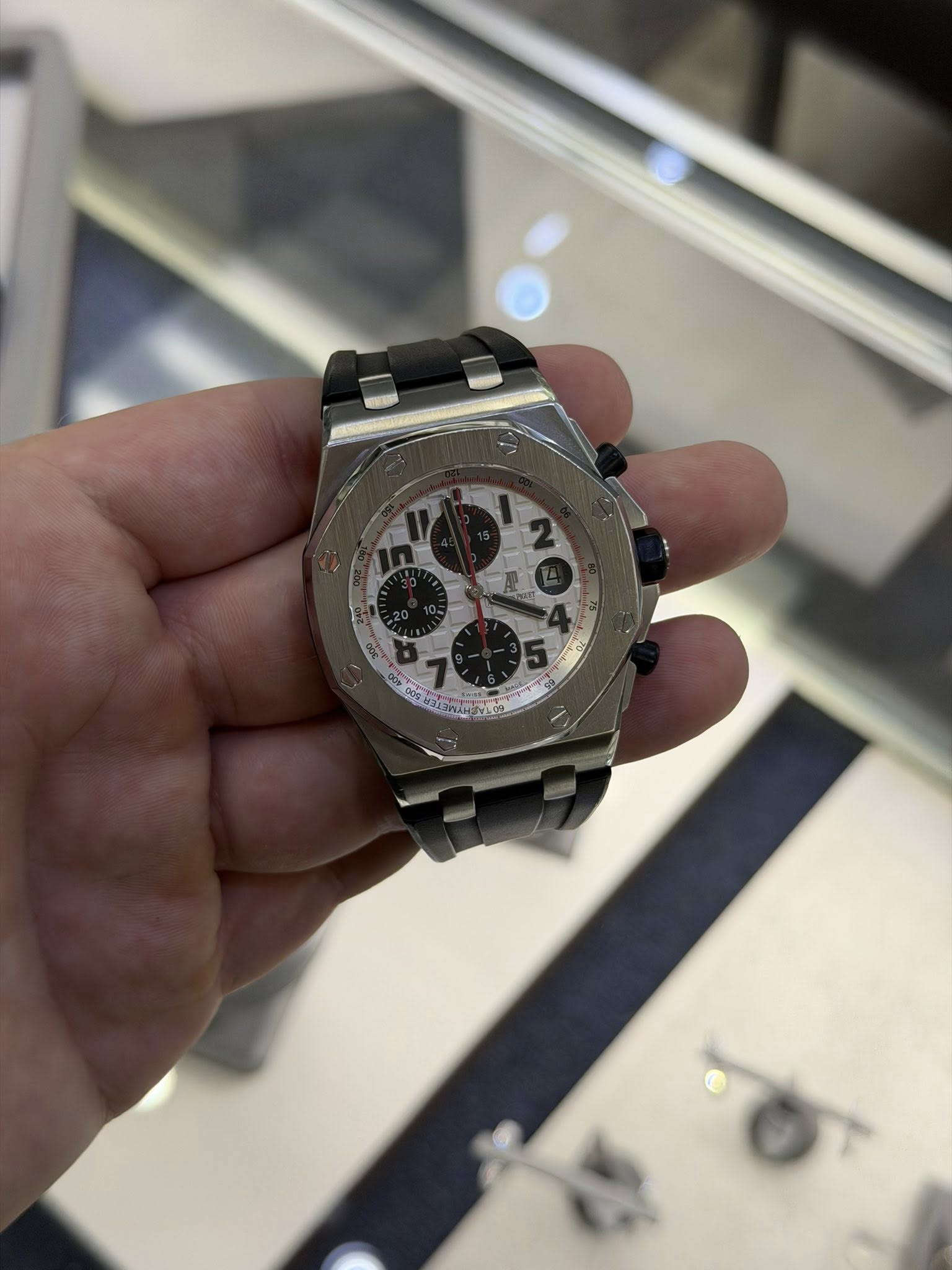 May be an image of wrist watch and text