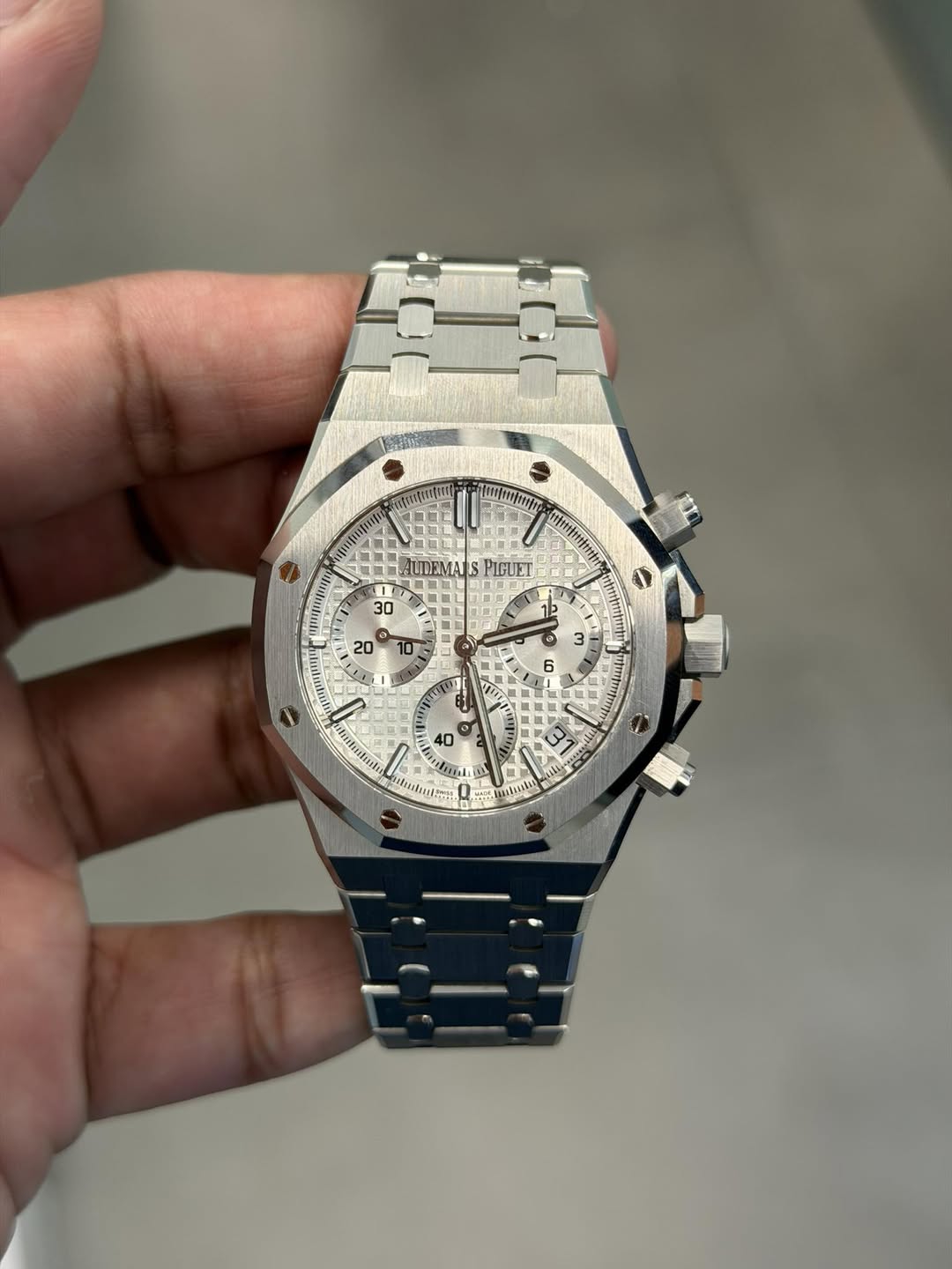 May be an image of wrist watch and text