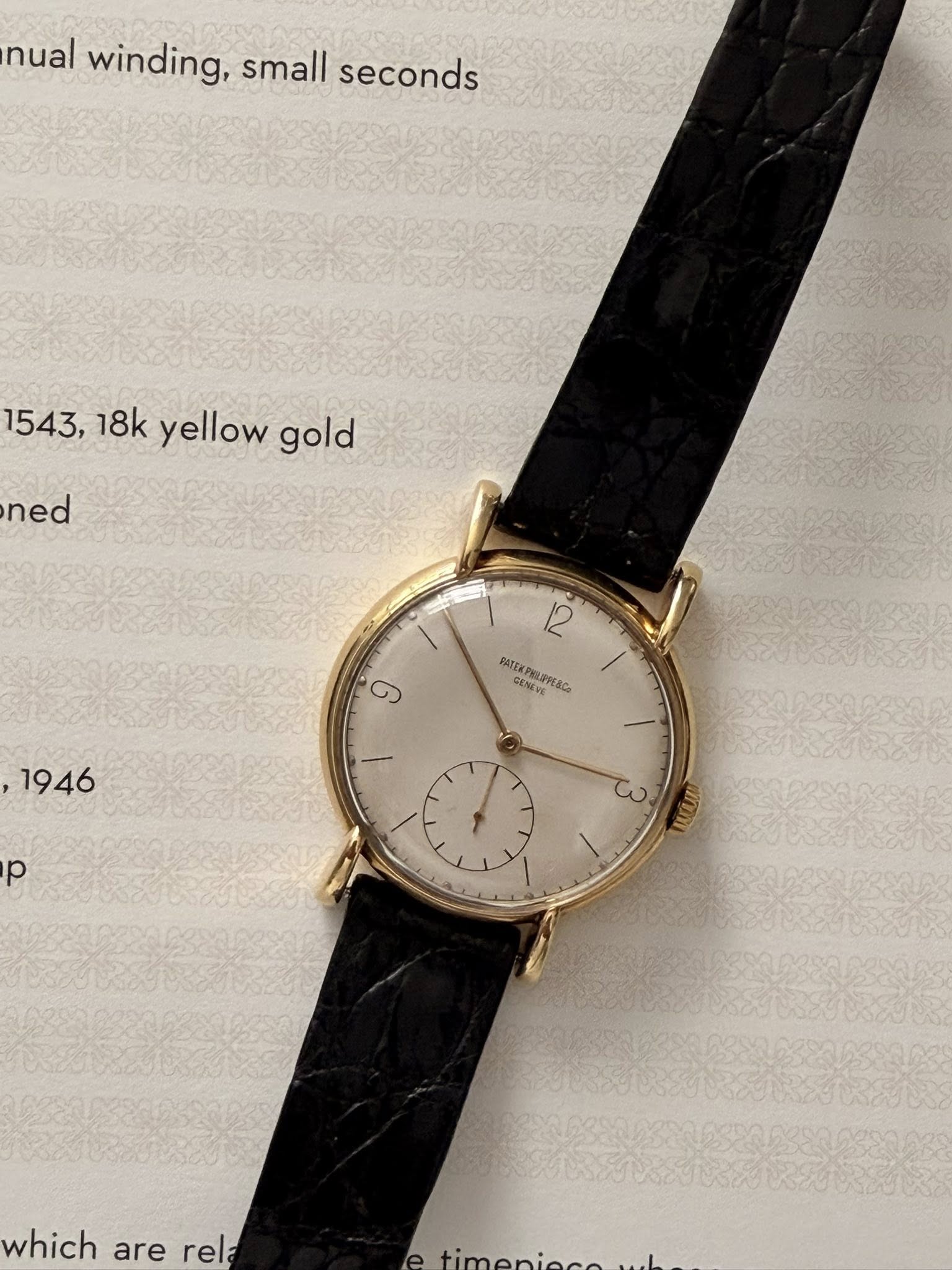 May be an image of wrist watch and text that says 'nual winding, small seconds 1543, 18k yellow gold ned TEO 12 MIEXPOLAREACO T BATEKPY CENENE و 1946 p حى which are rre rela'