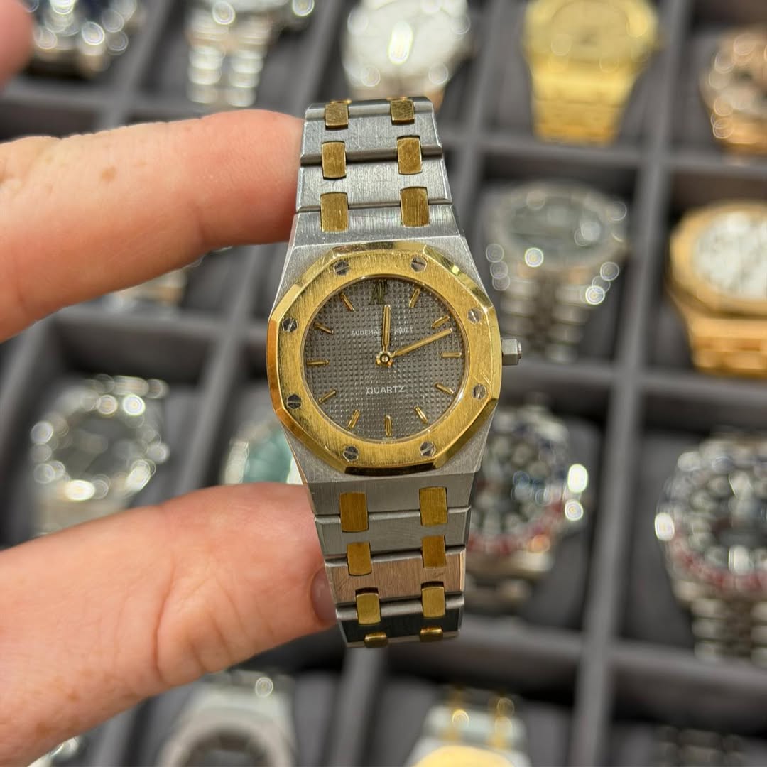 May be an image of wrist watch and text