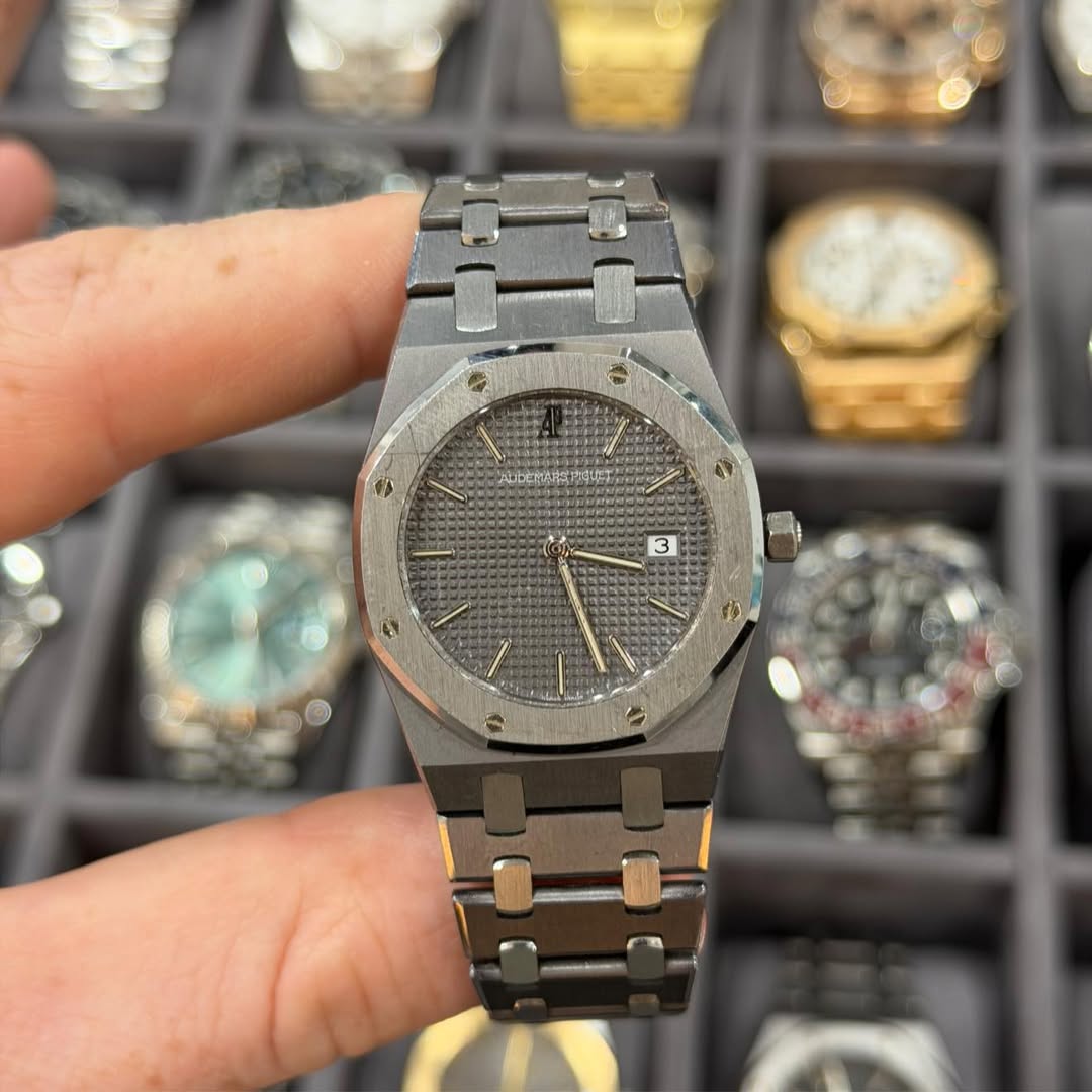 May be an image of wrist watch and text