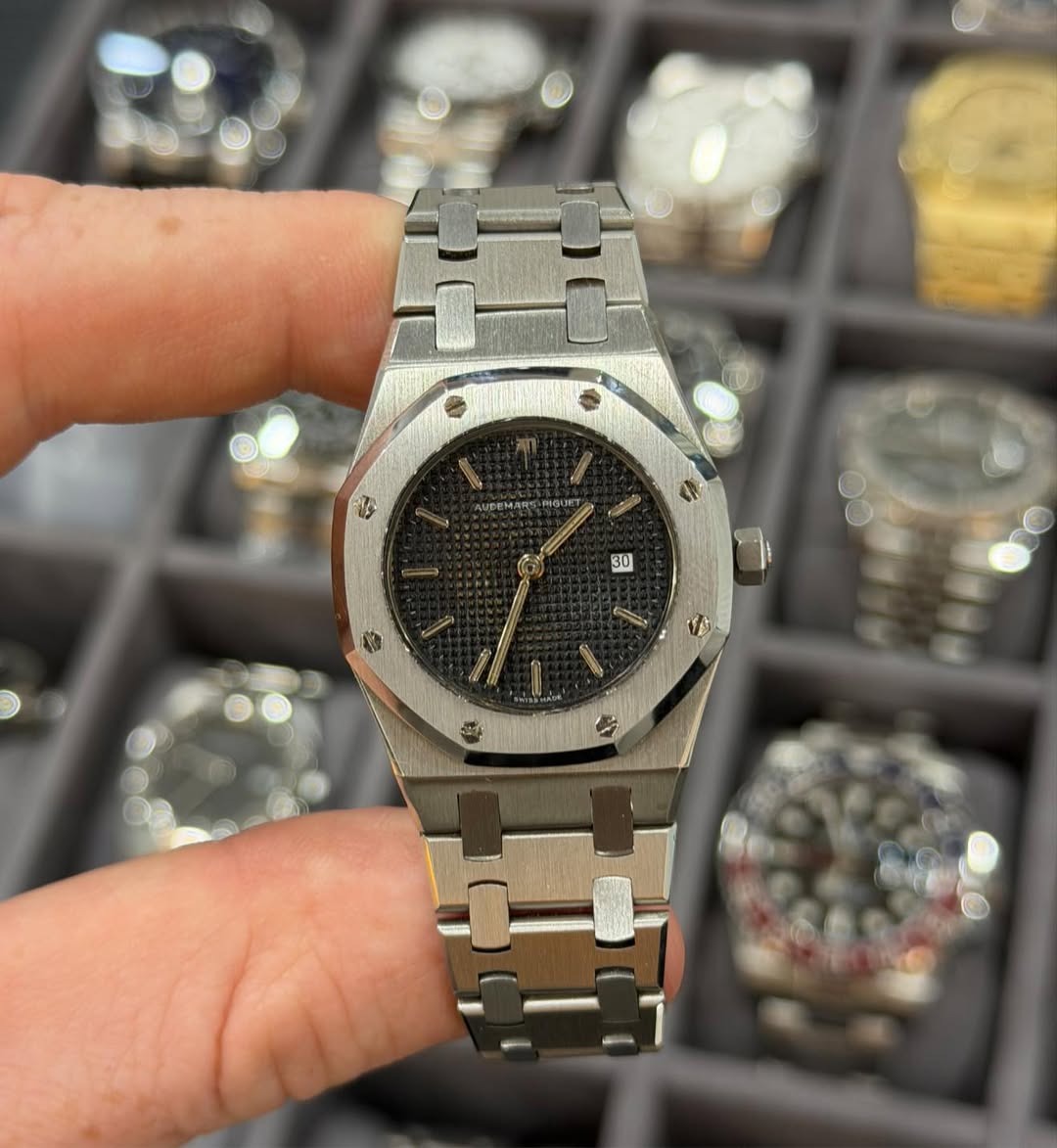 May be an image of wrist watch and text