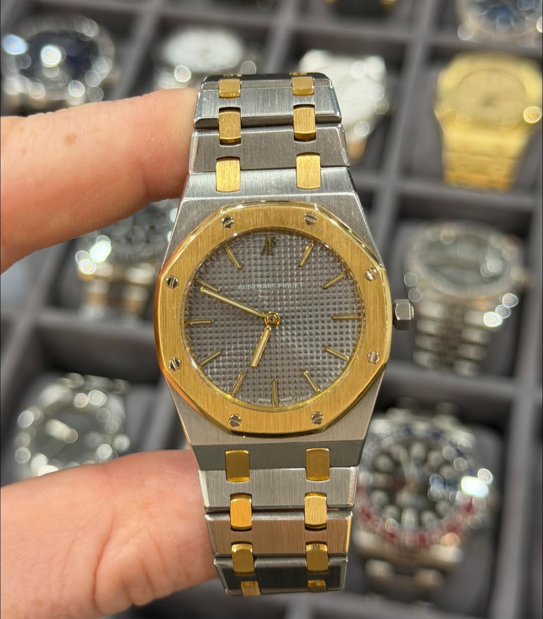 May be an image of wrist watch and text