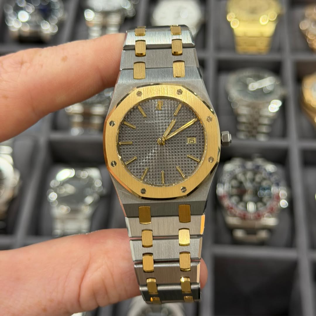 May be an image of wrist watch and text