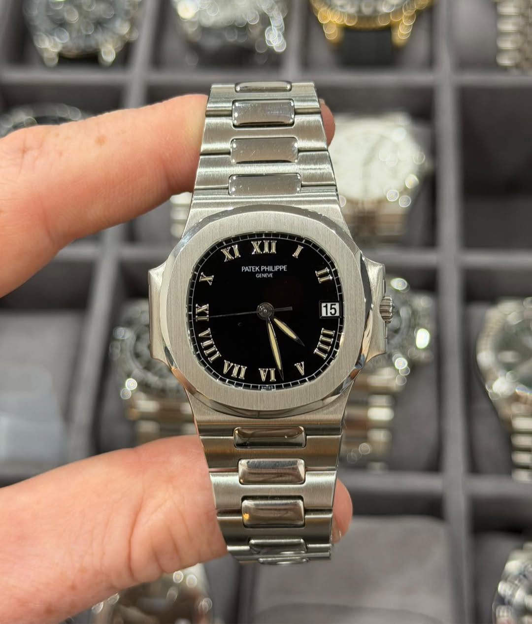May be an image of wrist watch and text that says 'Xx XXI PATEKPHILIPPE ENIVE مد tie 15 III ር! VI V'