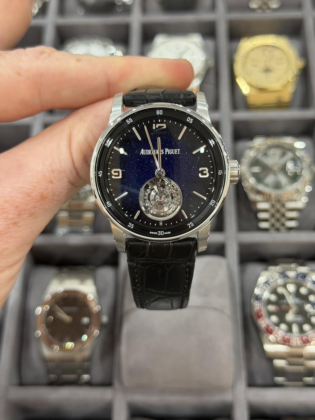 May be an image of wrist watch and text