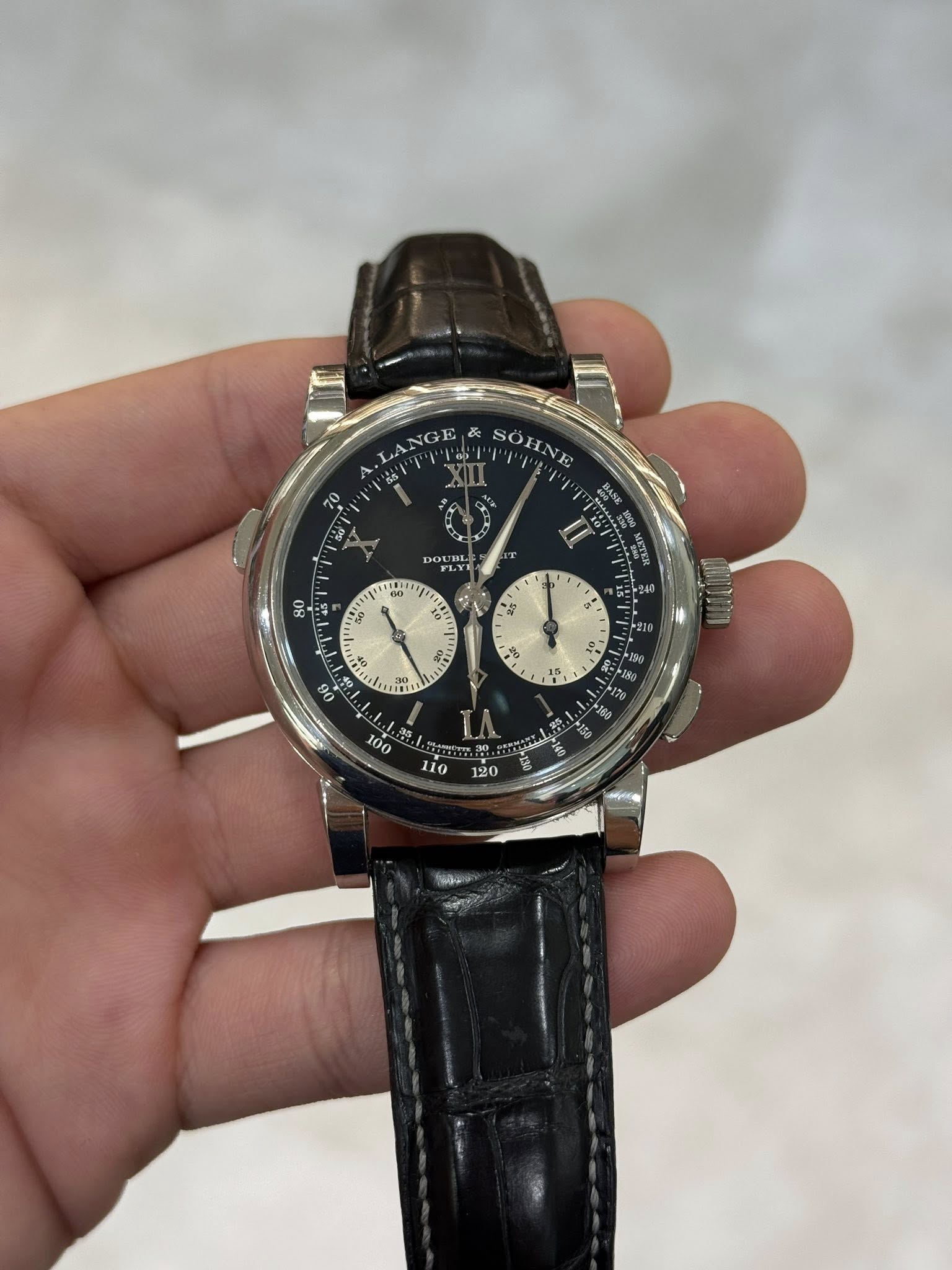 May be an image of wrist watch and text