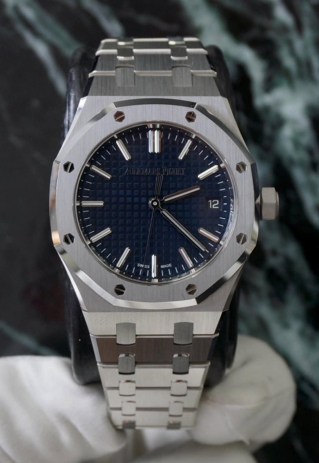 May be an image of wrist watch and text that says '12 SWSS MADE'
