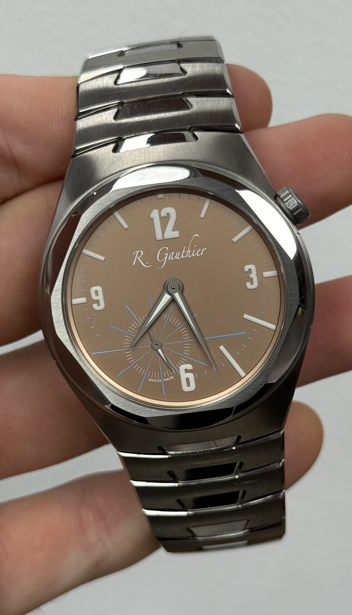 May be an image of wrist watch and text