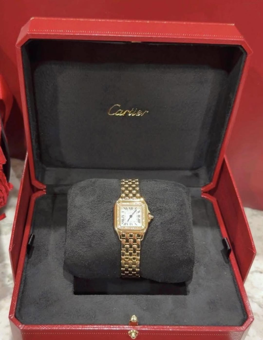 May be an image of wrist watch and text