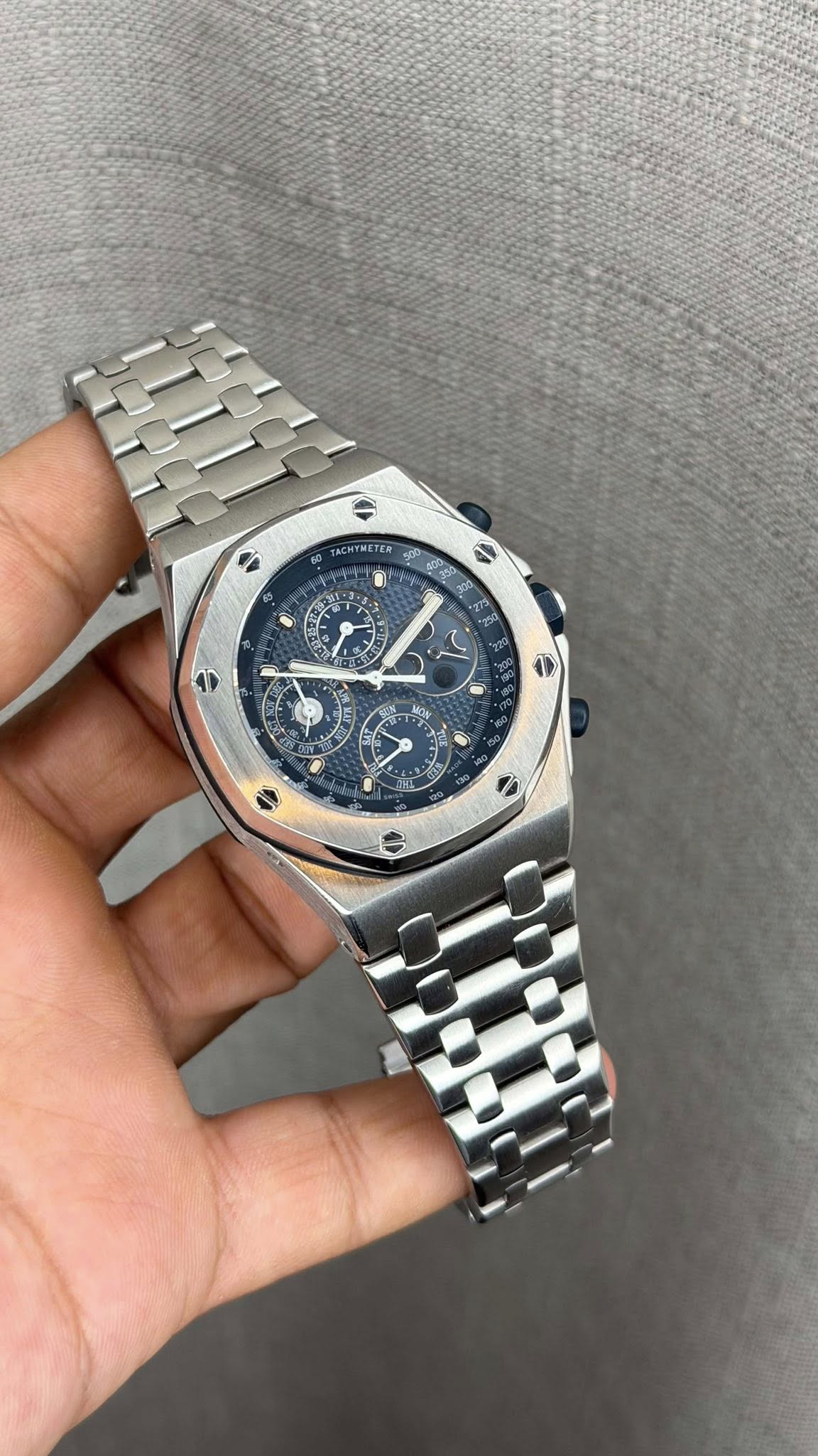 May be an image of wrist watch and text