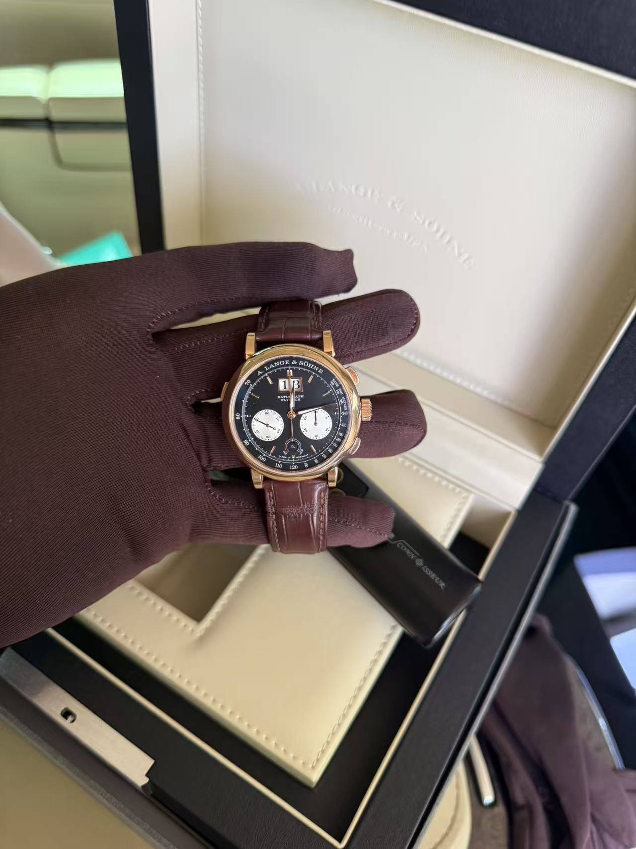 May be an image of wrist watch and text