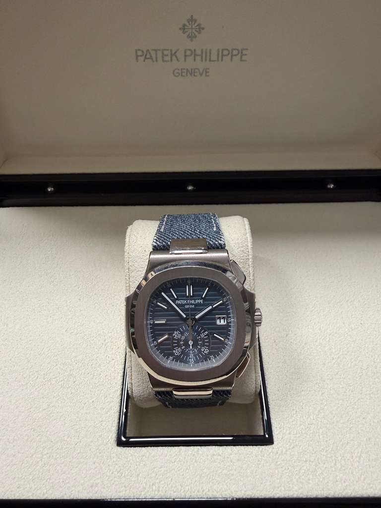 May be an image of wrist watch and text that says 'PATEKPHILIPPE PATEKP GENEVE A A PATEK ATEKFHLIPI KFH FHL HU IPPE 11 မ့တြား e'