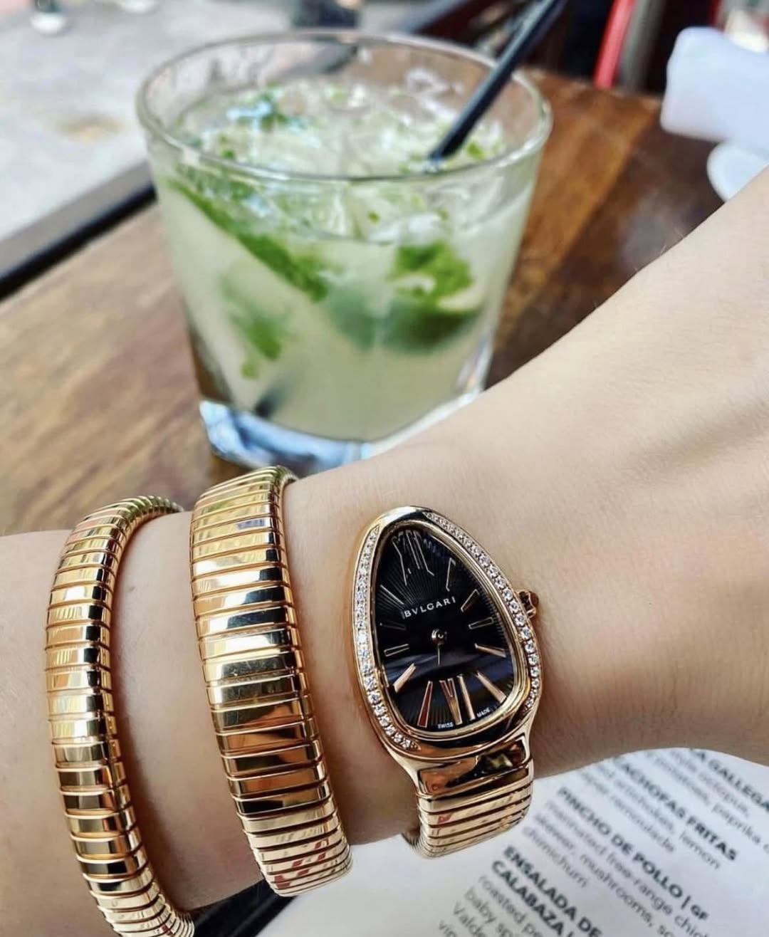 May be an image of wrist watch and jewelry