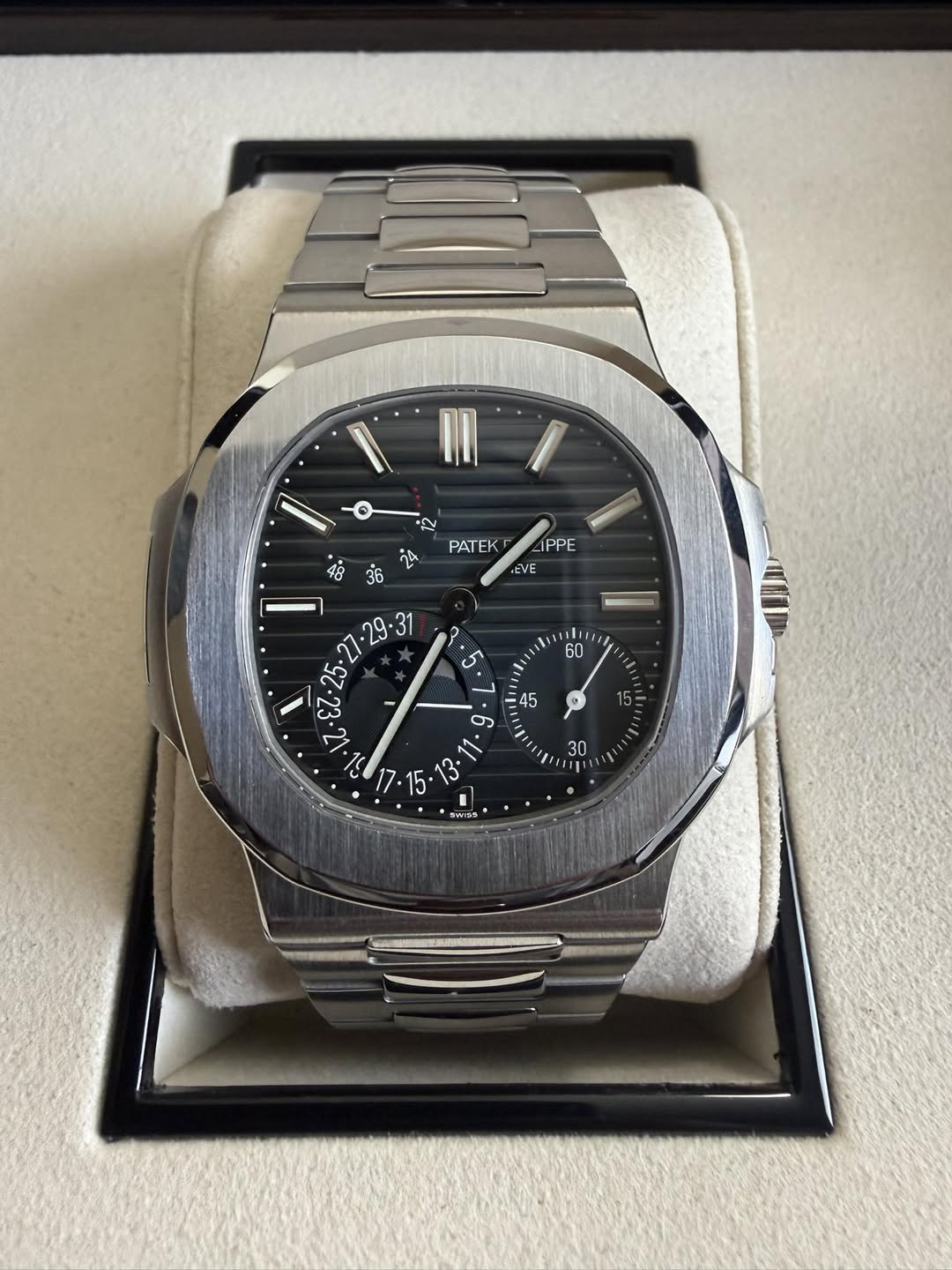 May be an image of wrist watch and text