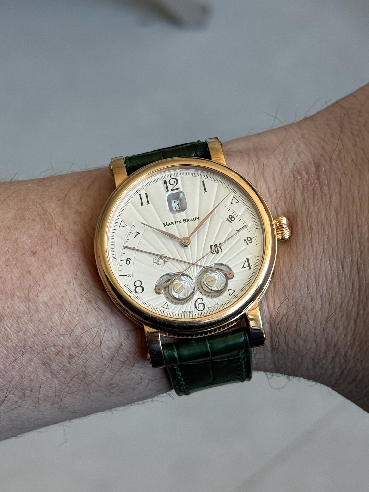 May be an image of wrist watch and text