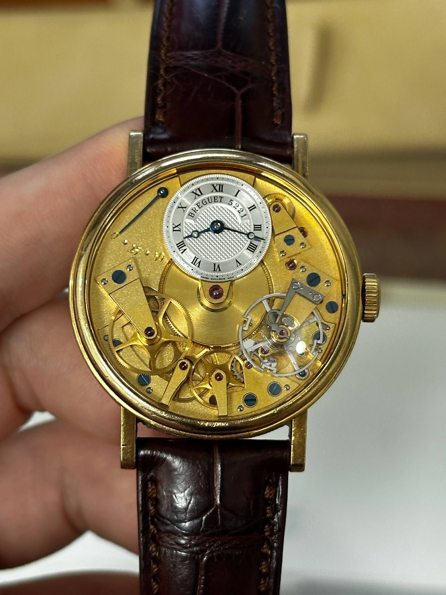May be an image of wrist watch and text