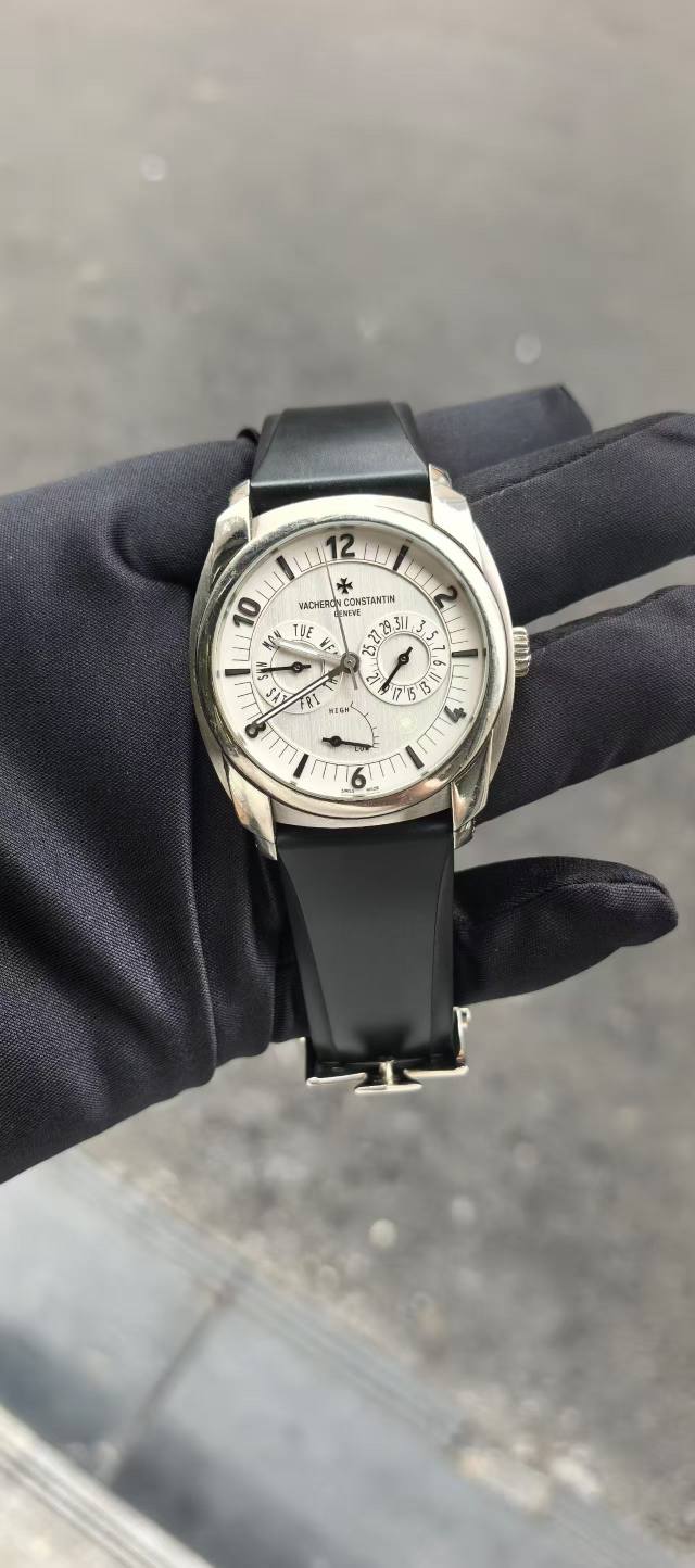May be an image of wrist watch and text
