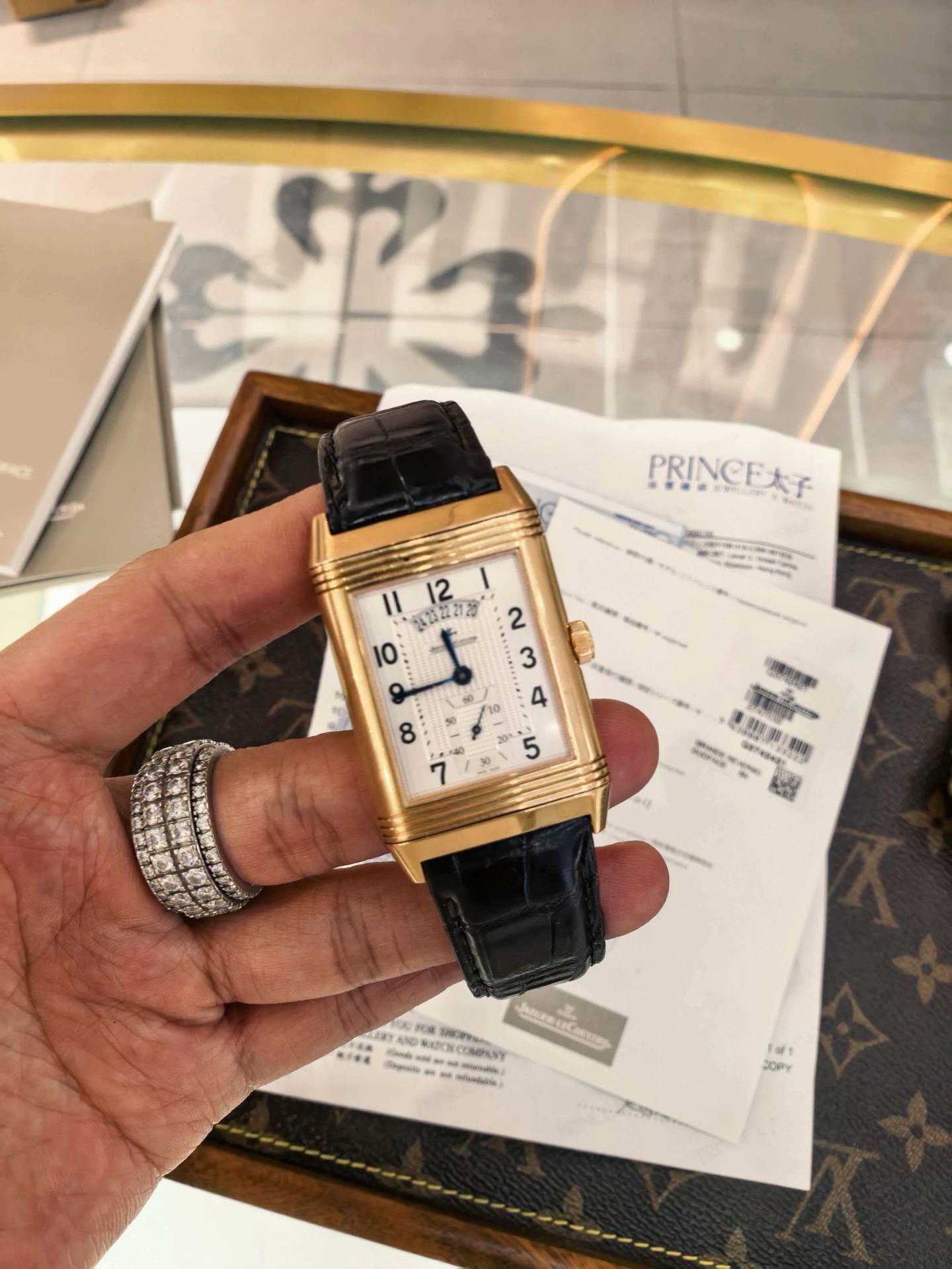 May be an image of wrist watch and text