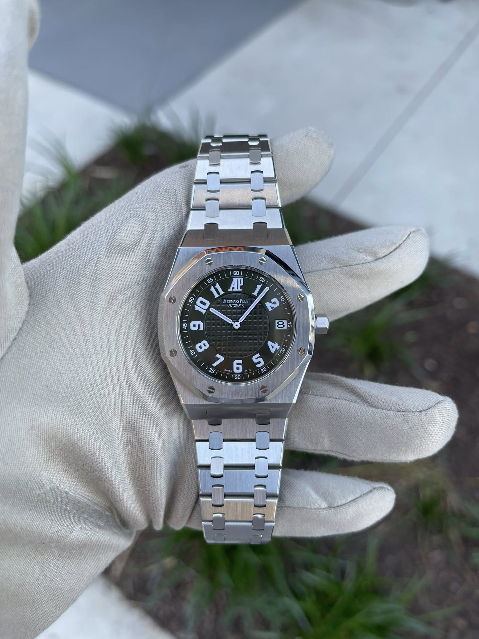 May be an image of wrist watch and text