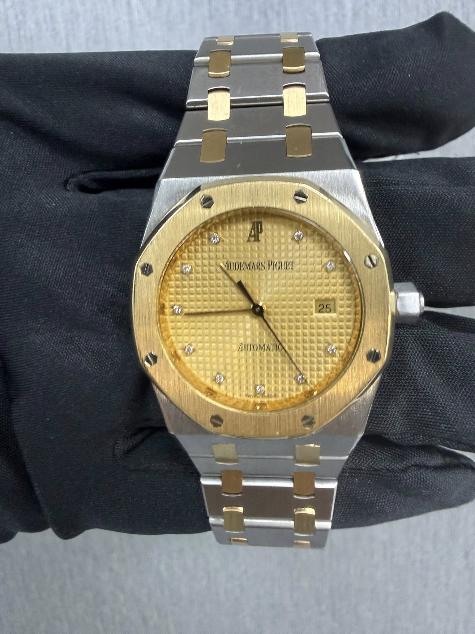 May be an image of wrist watch and text