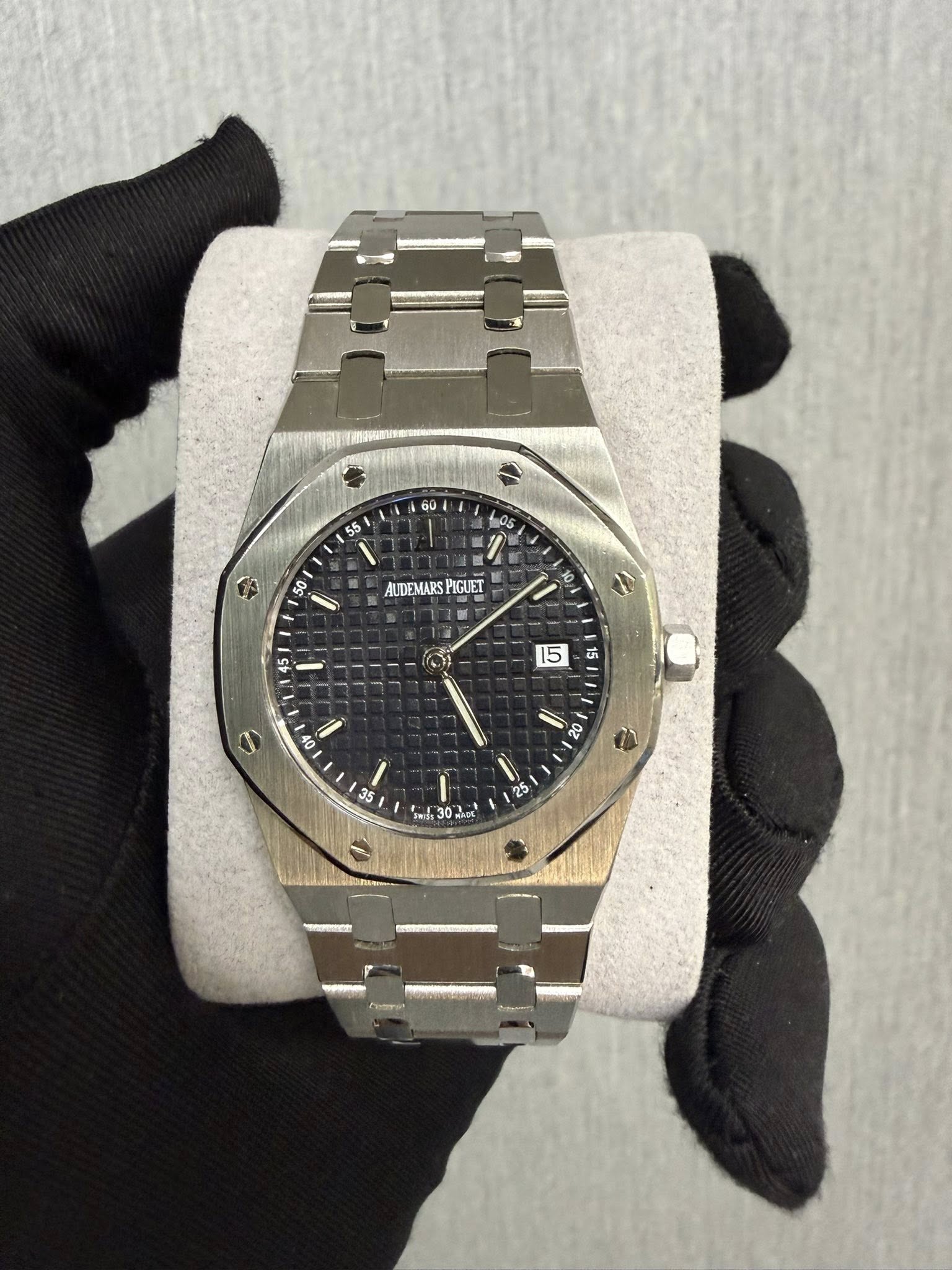 May be an image of wrist watch and text that says '60 55 05 수 50 50 I AUDEMARSPIGUET AUDEMARS PIGUET 45 5 15 OF 2 08 35 مى ရိမ်း I 31302 L3 2o'