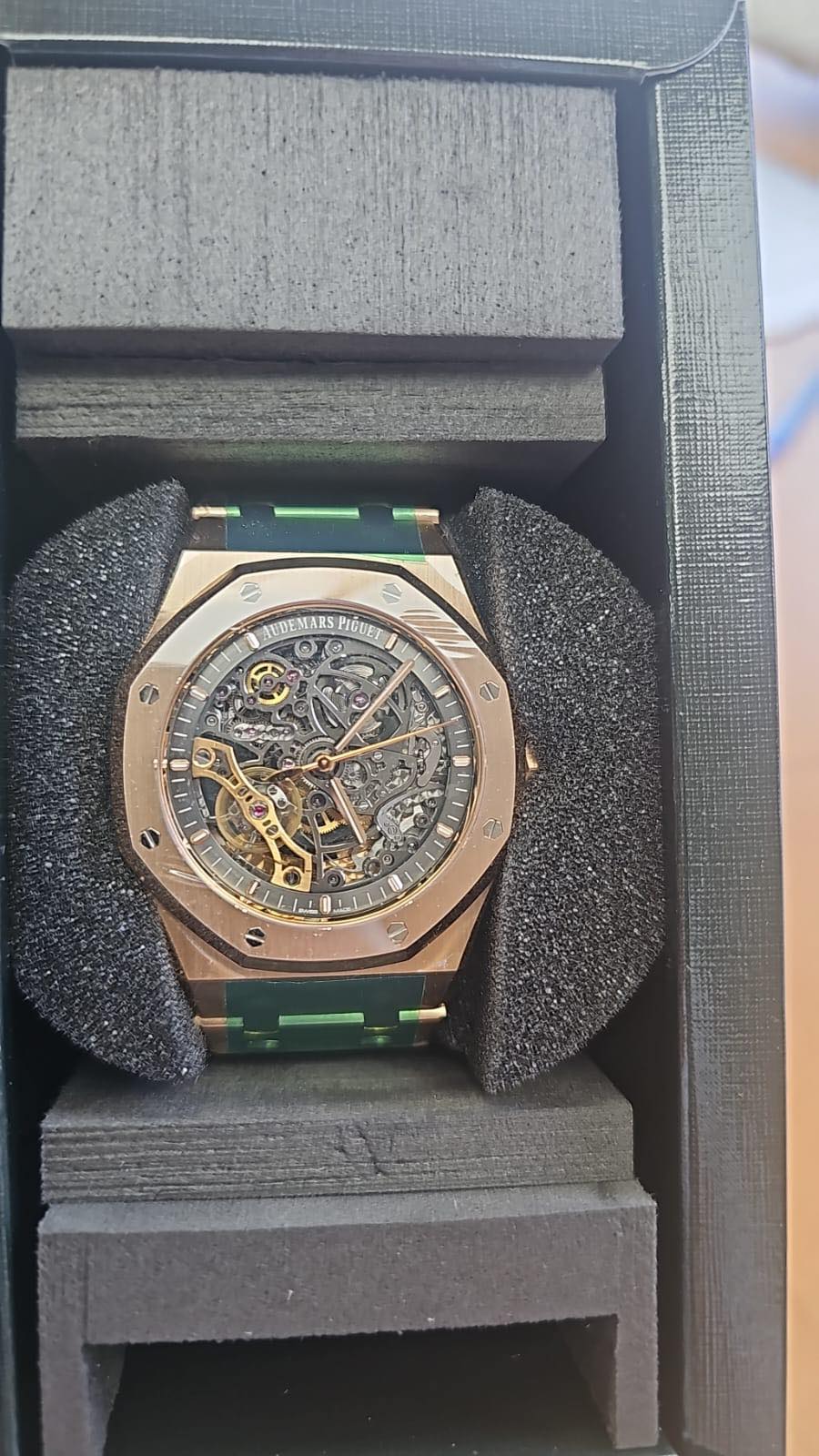 May be an image of wrist watch and text