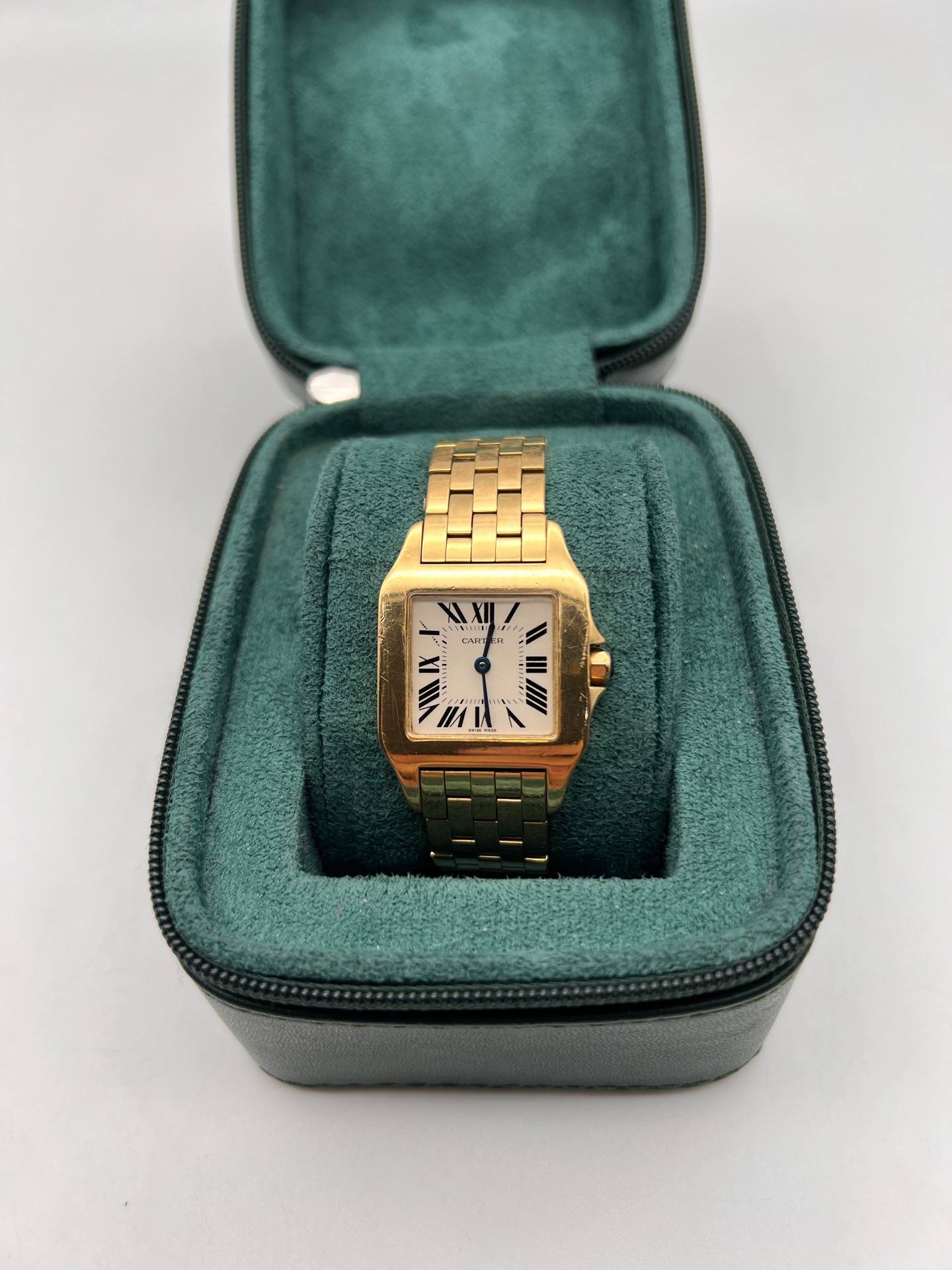 May be an image of wrist watch and text