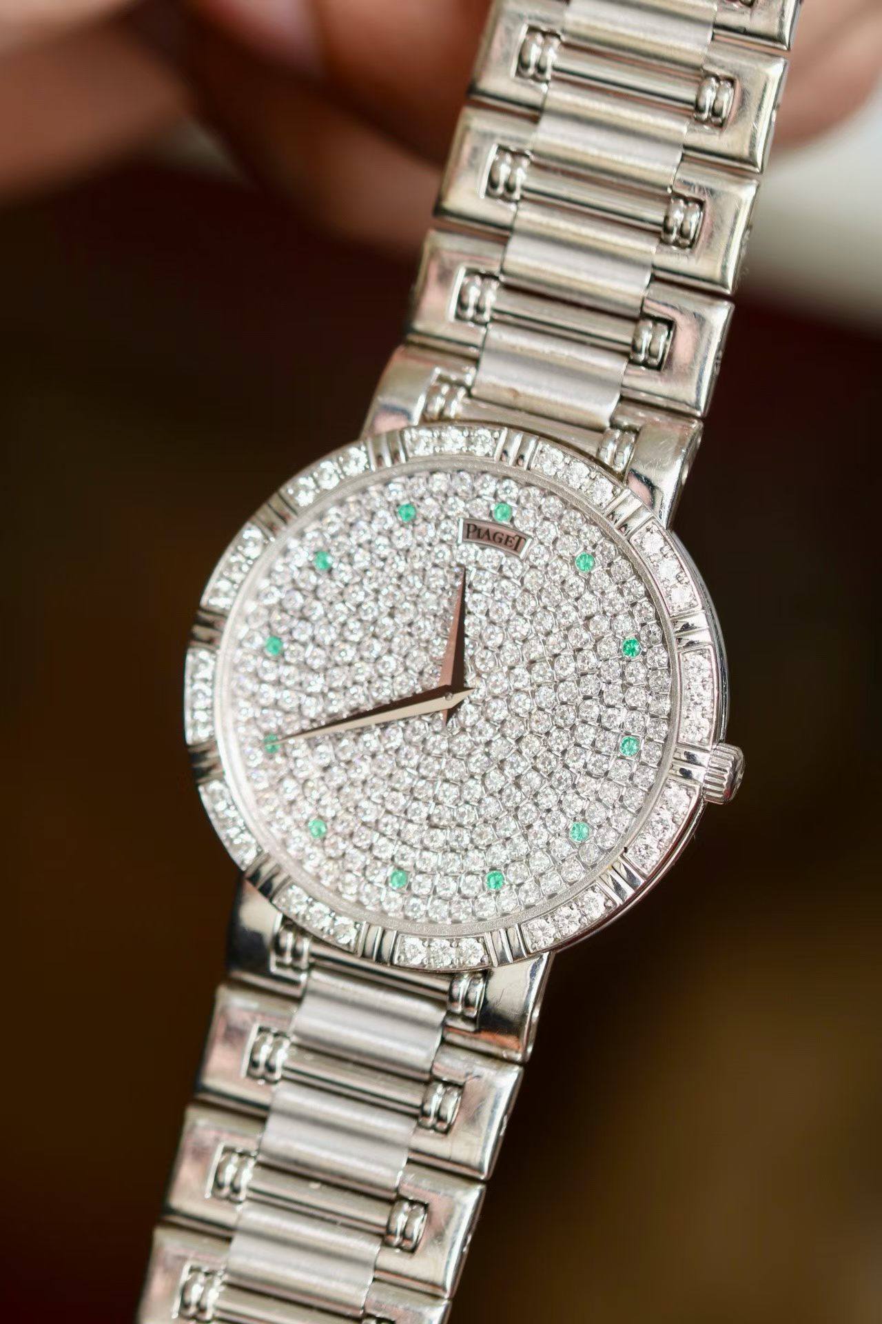 May be an image of wrist watch and text
