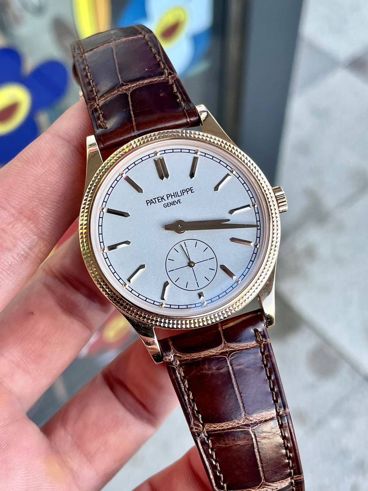 May be an image of wrist watch and text that says 'PHILIPPE PATEK GENEVE I'