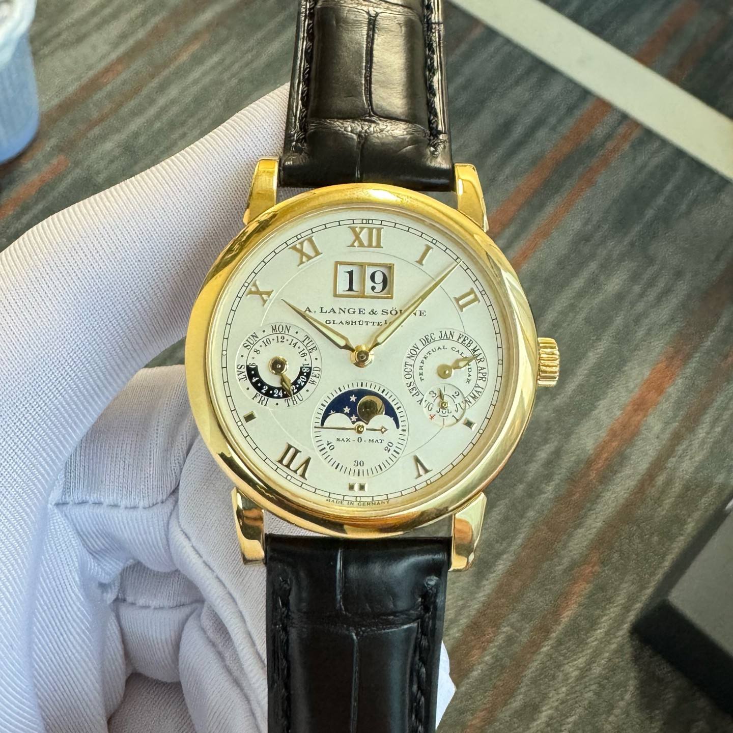May be an image of wrist watch and text