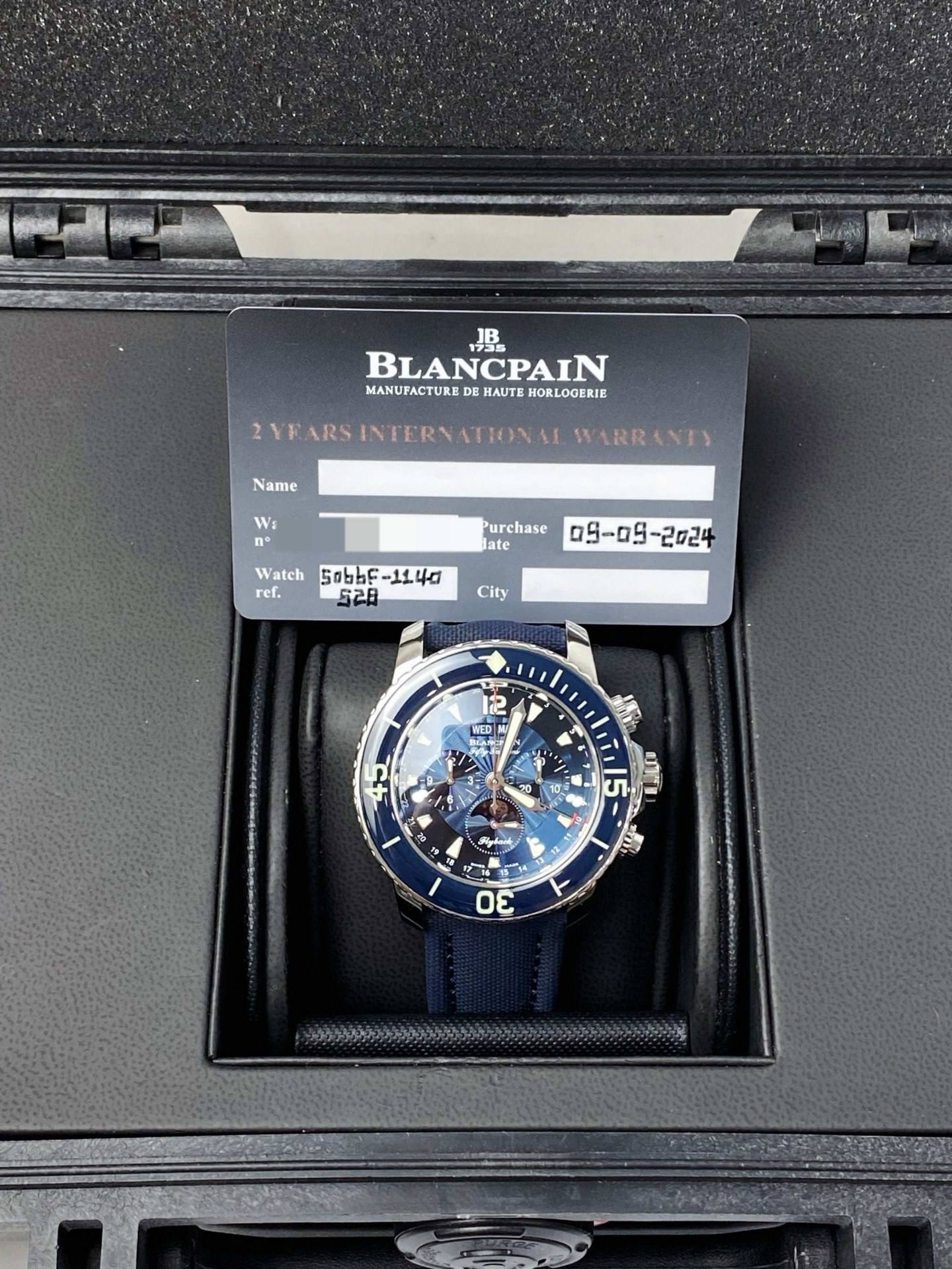 May be an image of wrist watch and text that says 'JB BLANCPAIN MANUFACTURE DE MANUFACTUKEDE:MAUTEHORLOOFRIE HAUTE HORLOOERIE Name YEARS INTER FARSINTERVATIONAI ATIONAE WARR INTY…