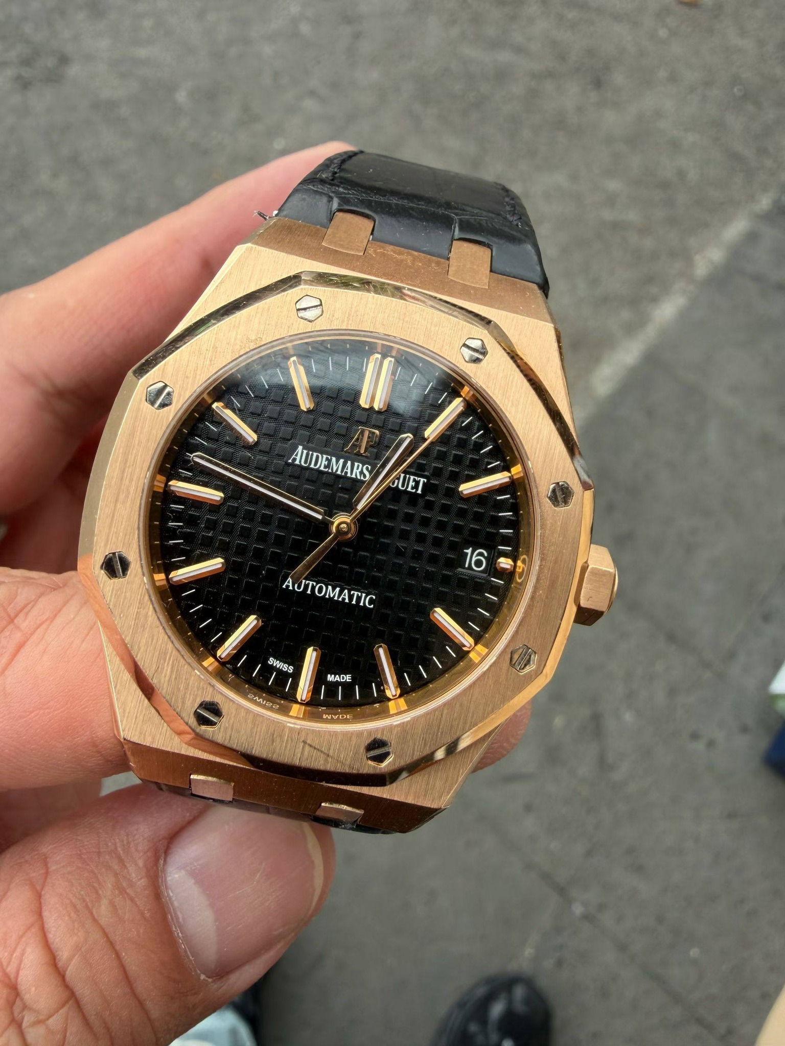 May be an image of wrist watch and text