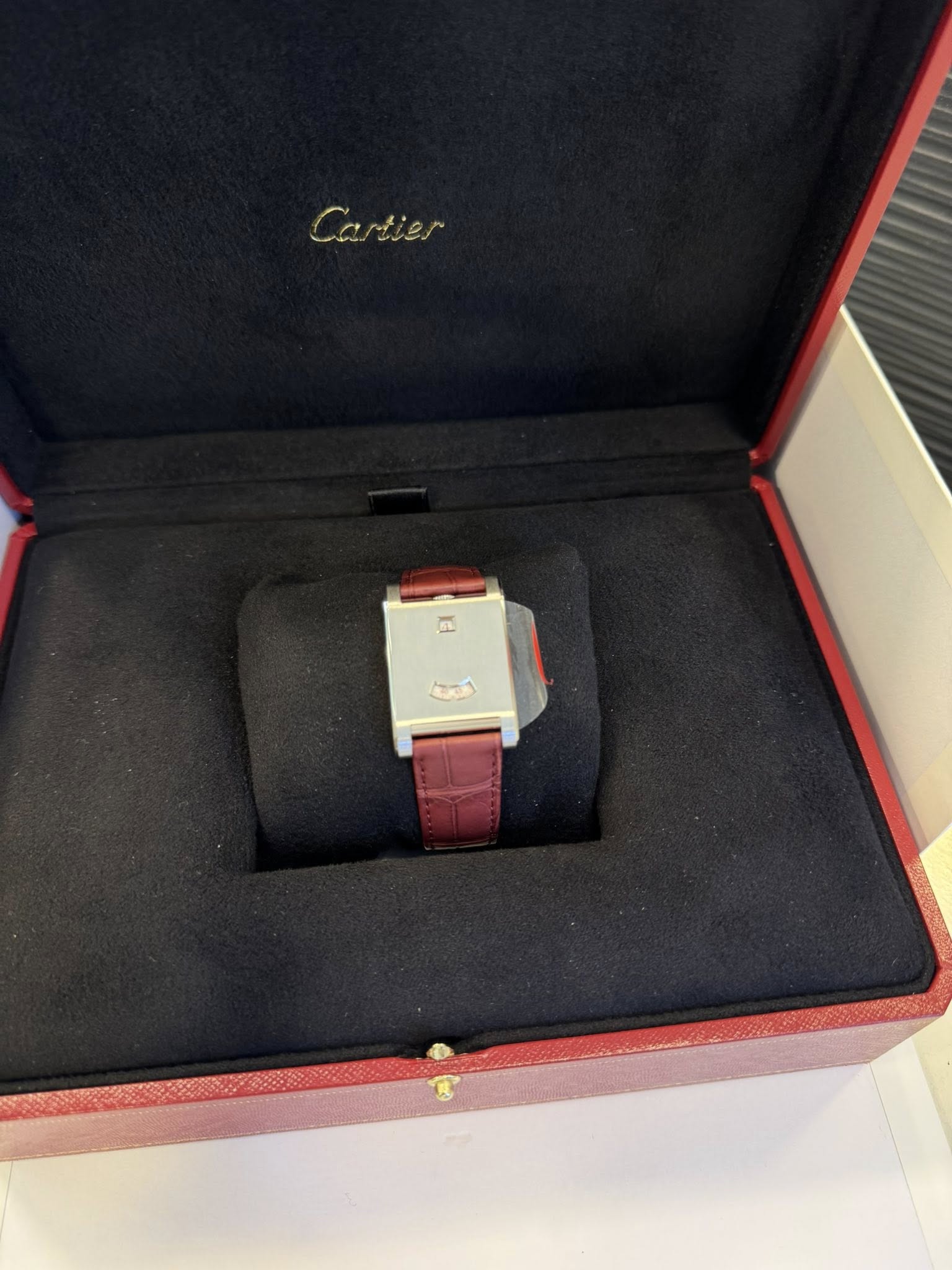 May be an image of wrist watch and text that says 'Cartier'