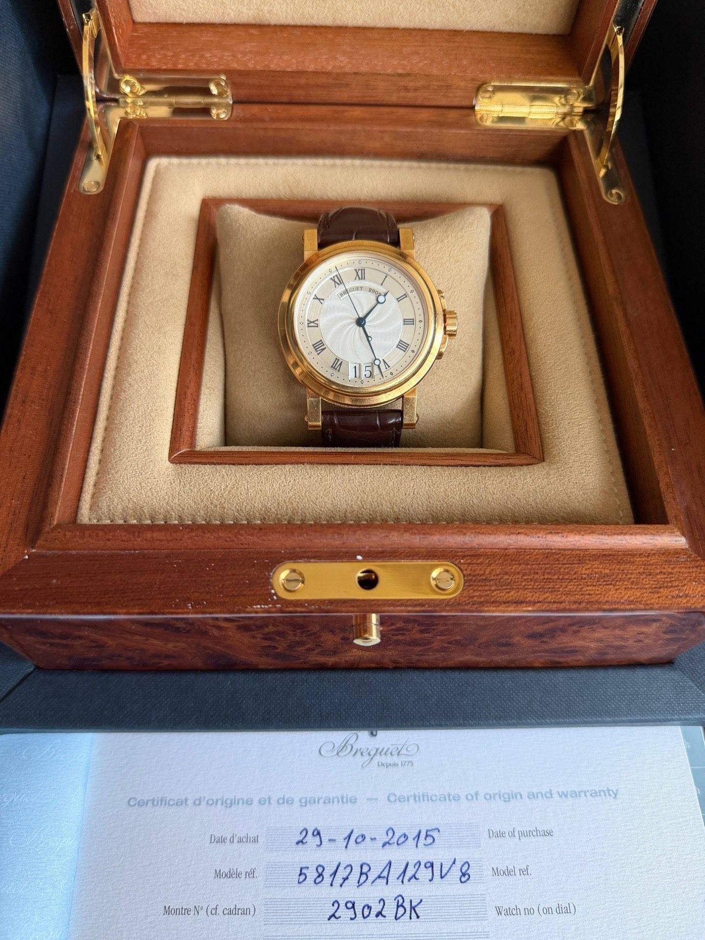 May be an image of wrist watch and text that says 'ATI QSET به 1 mA RA 國 ATL طلم 0 Bregueto 1kp44n1973 Certificat f'origine et de garantie Date d'achiat Oertificate of origin…